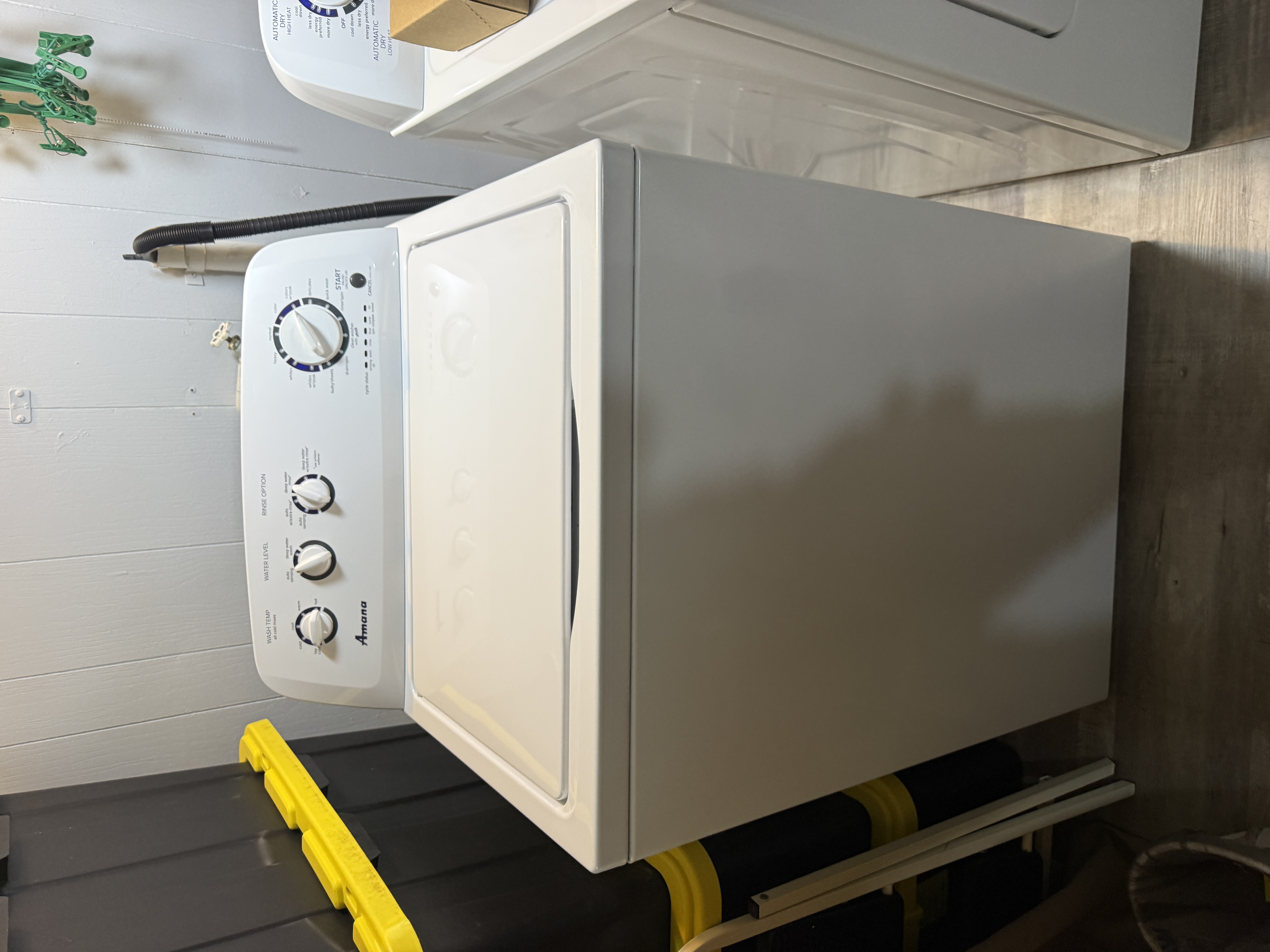 Amana top-load washer in a laundry room in Oldsmar