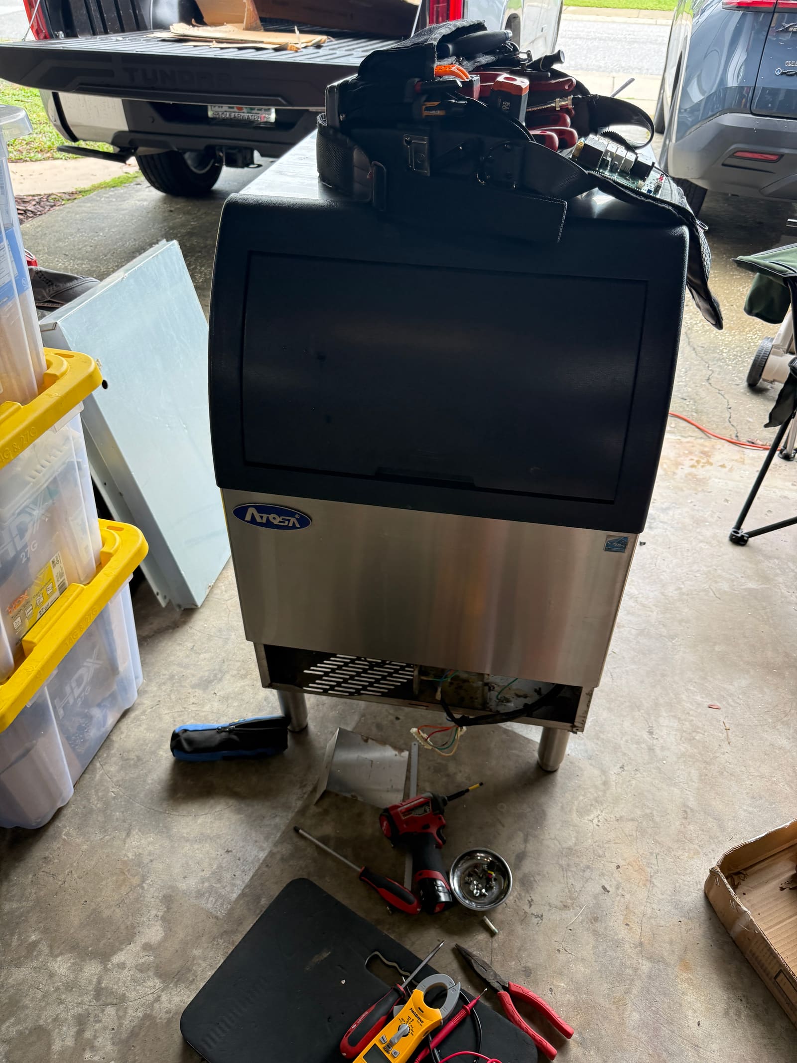 Restored Atosa undercounter ice machine standing in a garage in Oldsmar