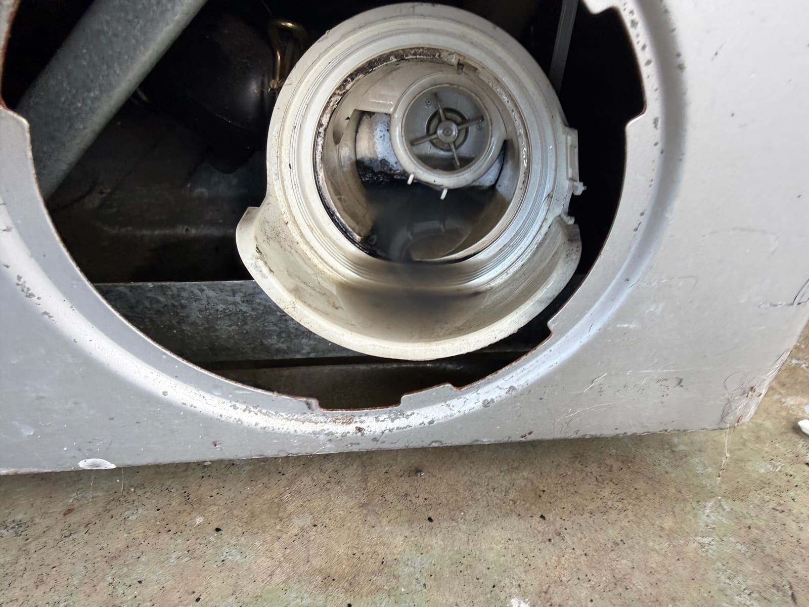 Rear drain outlet on the Bosch dryer where the extended tube connected