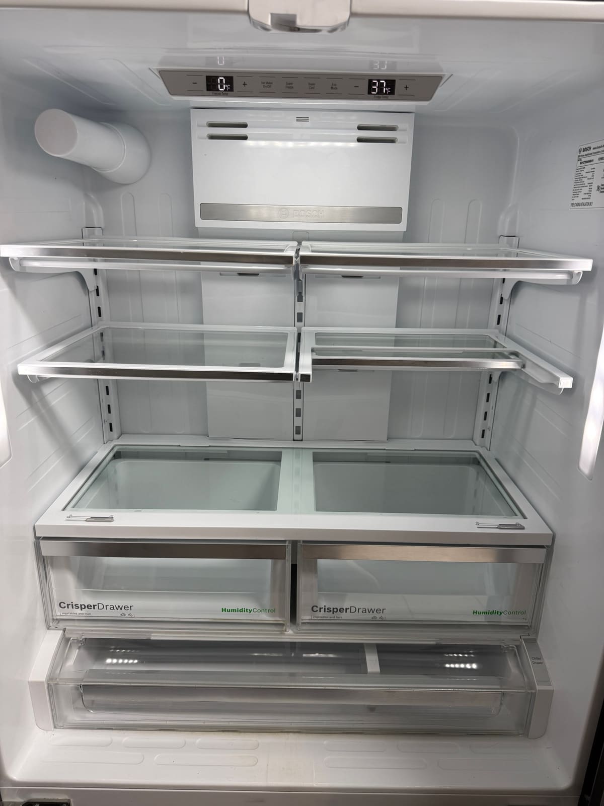 Inside a Bosch French door refrigerator after the repair, with the display showing 0°F in the freezer and 37°F in the fridge, in Westchase