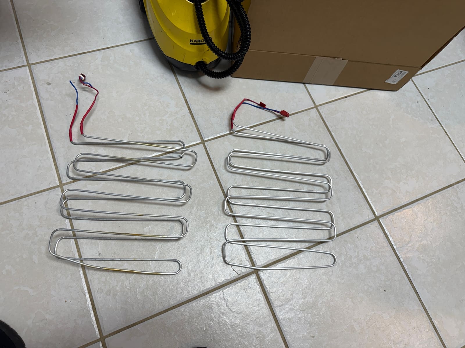 Old Bosch defrost heater on the left next to the new replacement heater on the right