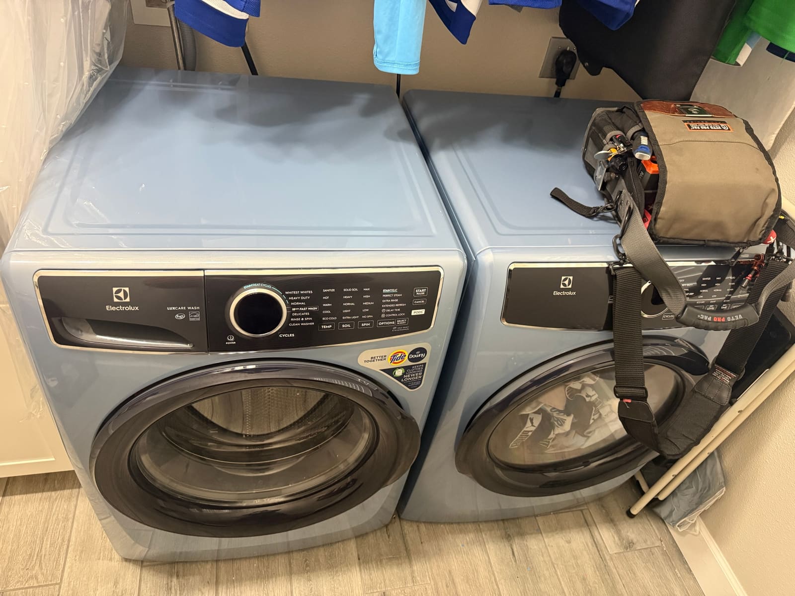 Light blue Electrolux front-load washer and matching dryer in a laundry room in Tarpon Springs