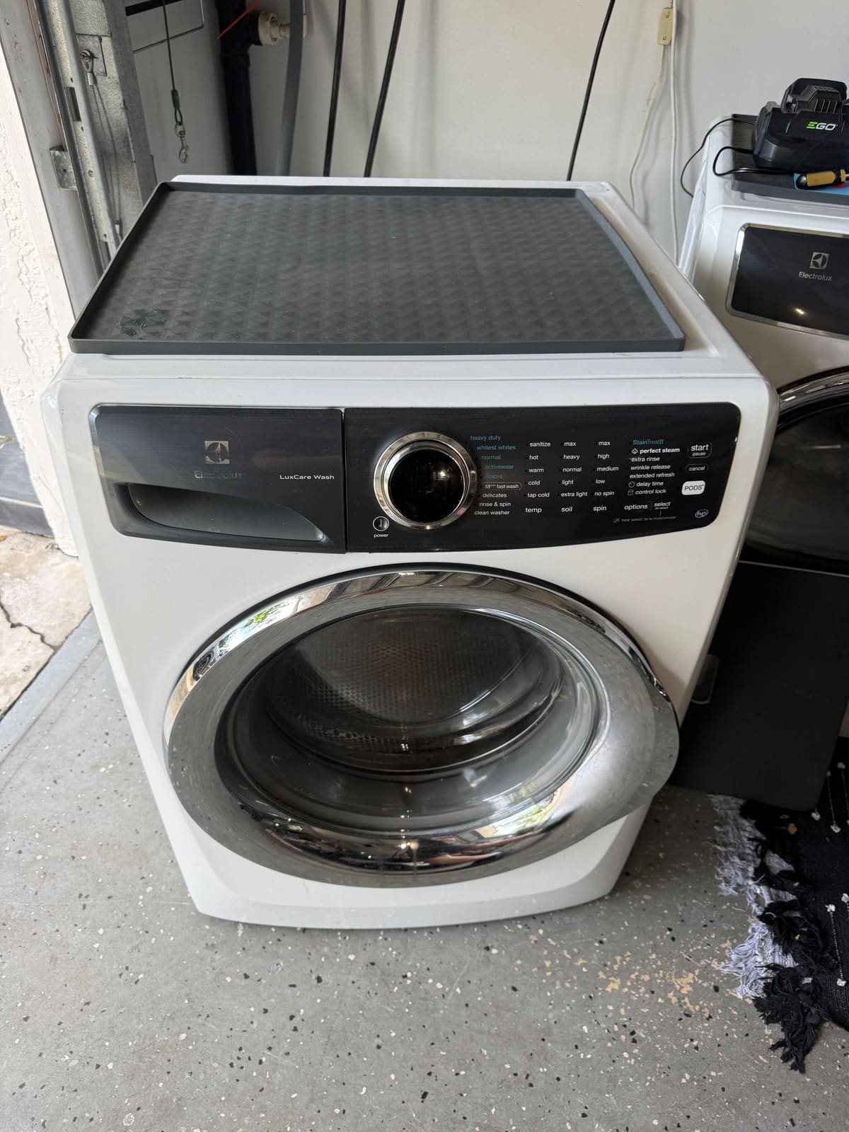 White Electrolux front-load washer in a garage in the Fairway Estates neighborhood of Dunedin