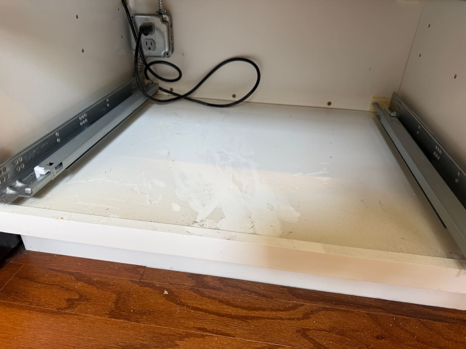 Outlet behind the wine cooler where the plug had come loose