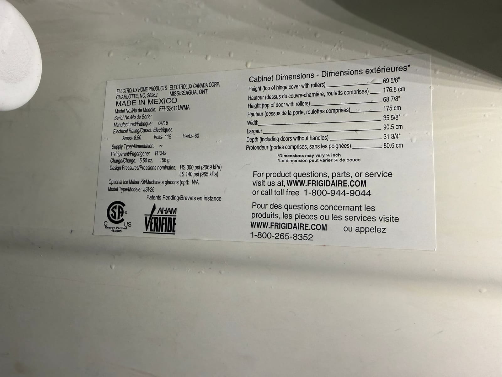 Frigidaire data plate showing model FFHS2611LWMA, manufactured 04/16, R134a refrigerant