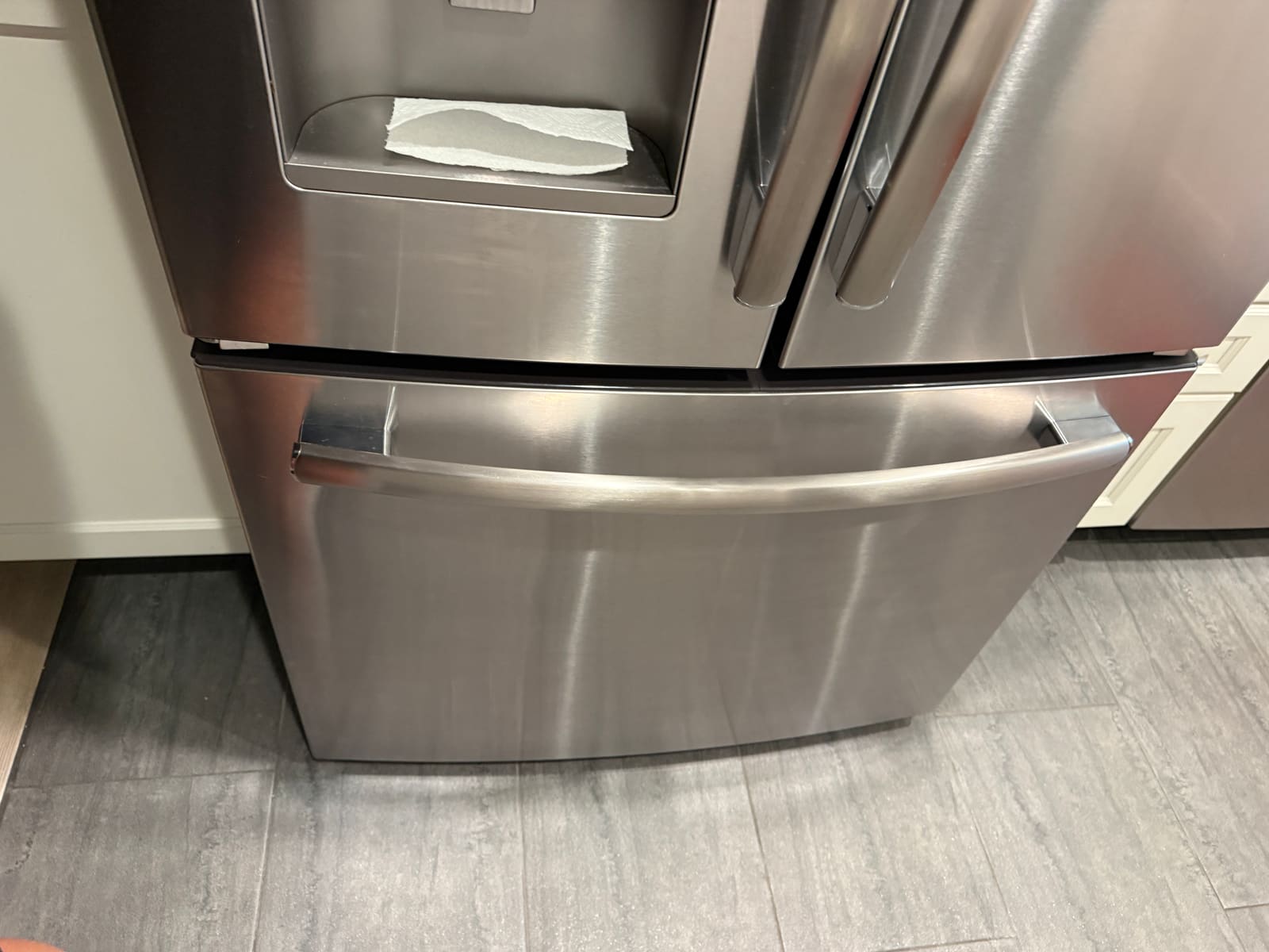 Top handle on a GE French-door refrigerator, the one that had come loose