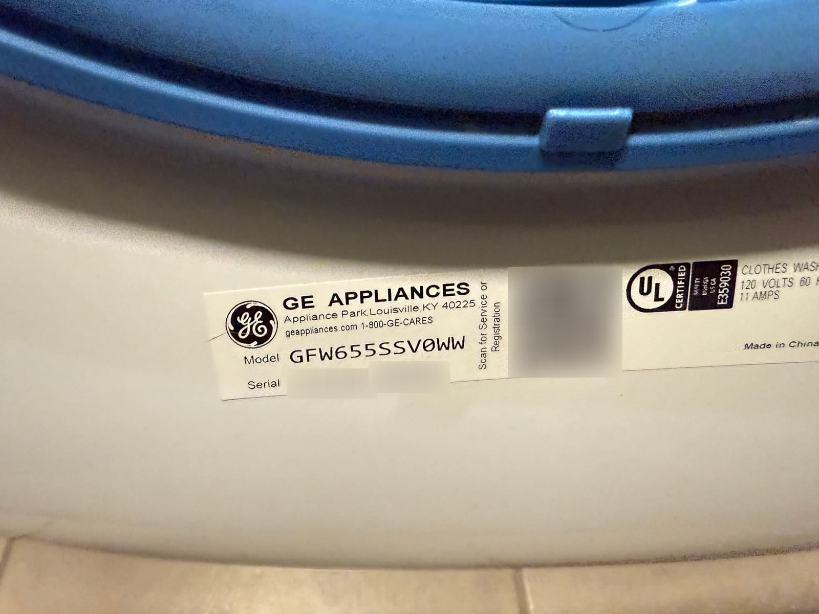 GE washer data plate, model GFW655SSV0WW, with the serial number and QR code blurred