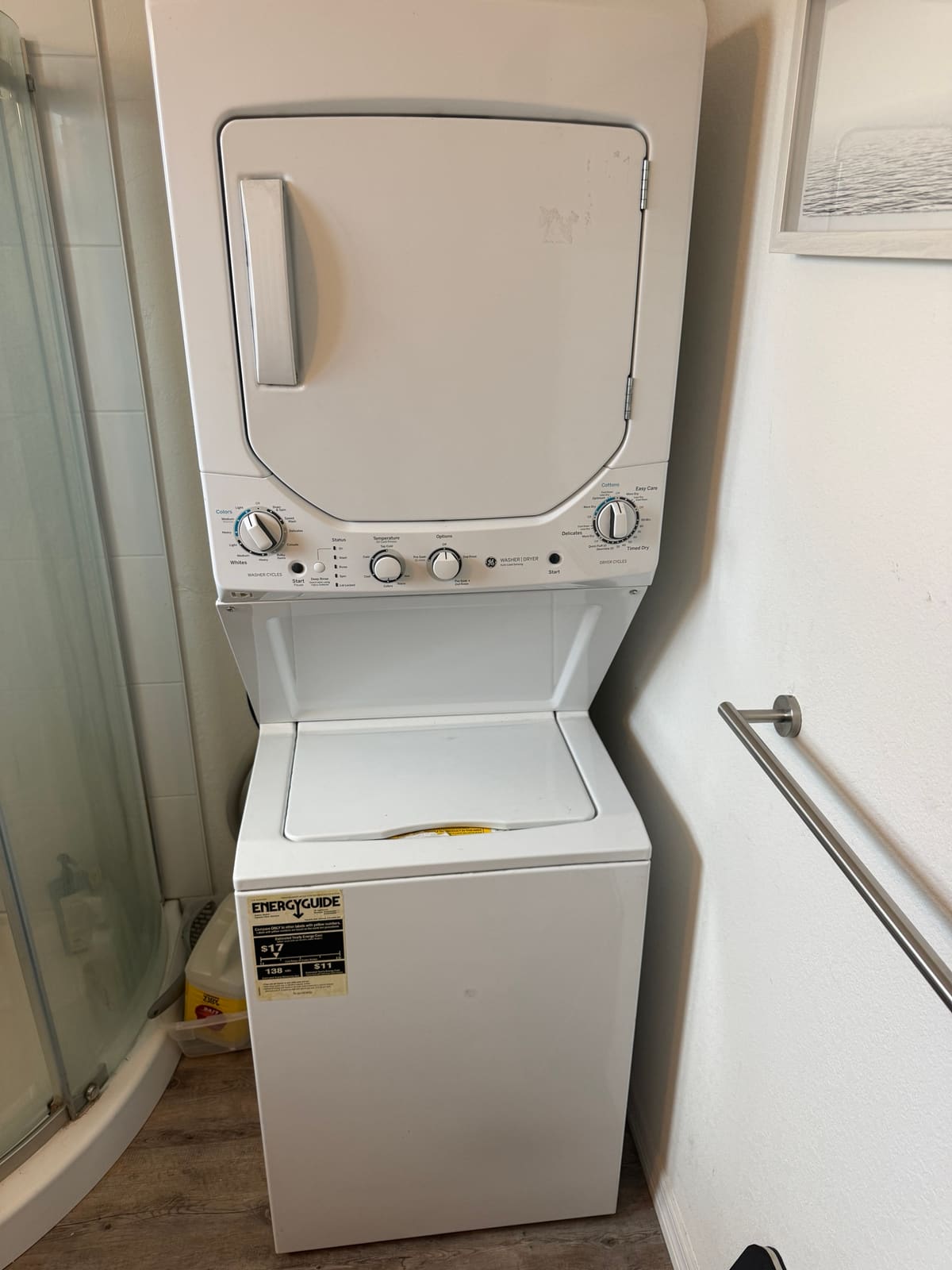 GE stacked washer and dryer laundry center in a bathroom in Dunedin