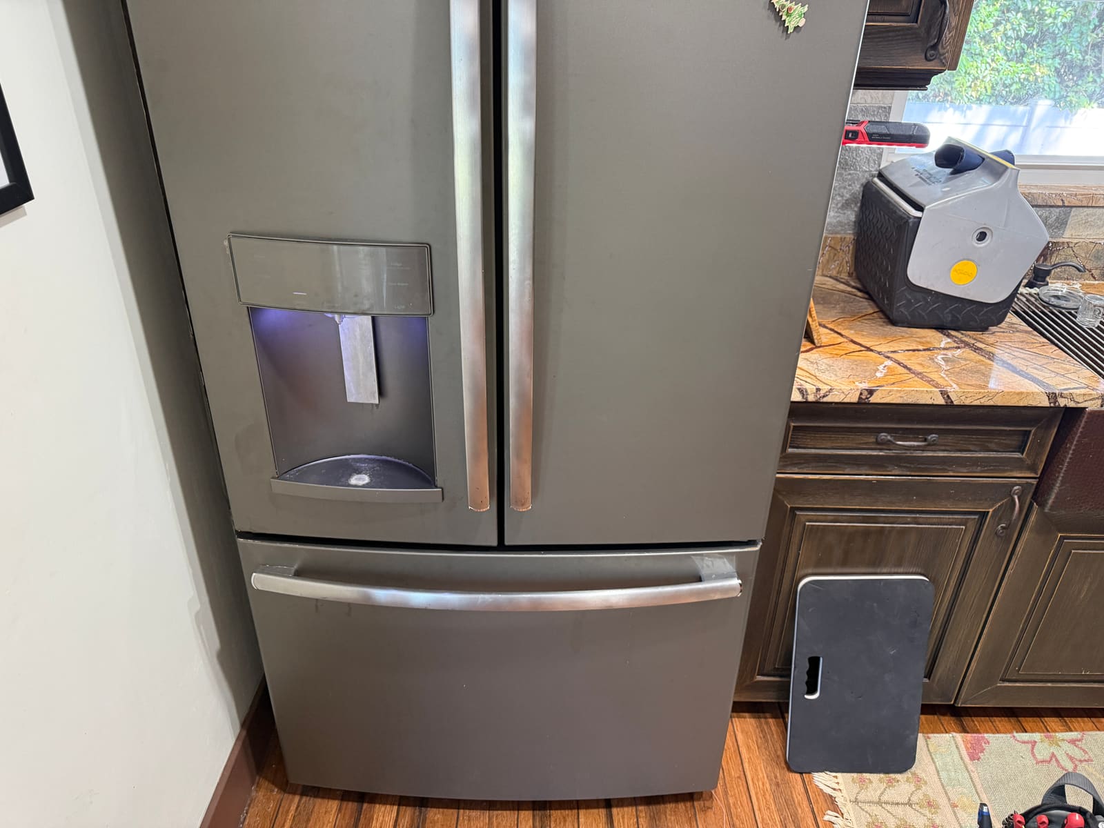 GE Profile French-door refrigerator with bottom freezer drawer in a kitchen in Largo