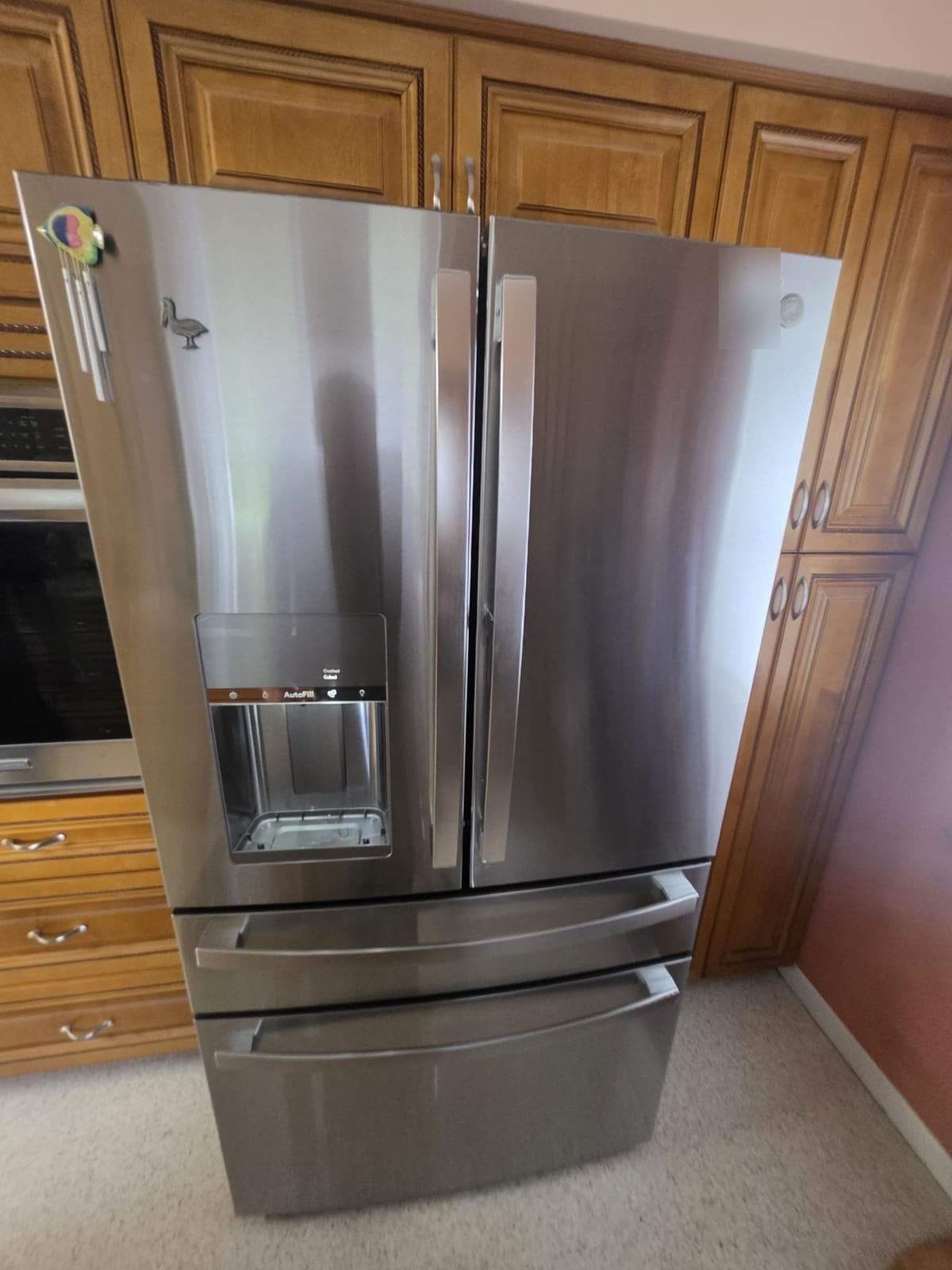 GE Profile stainless four-door French door refrigerator in a kitchen in Dunedin