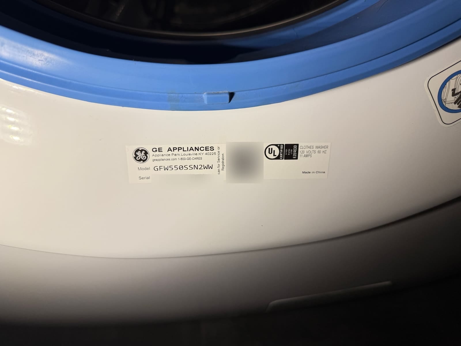GE Appliances data plate on a front-load washer showing model GFW550SSN2WW