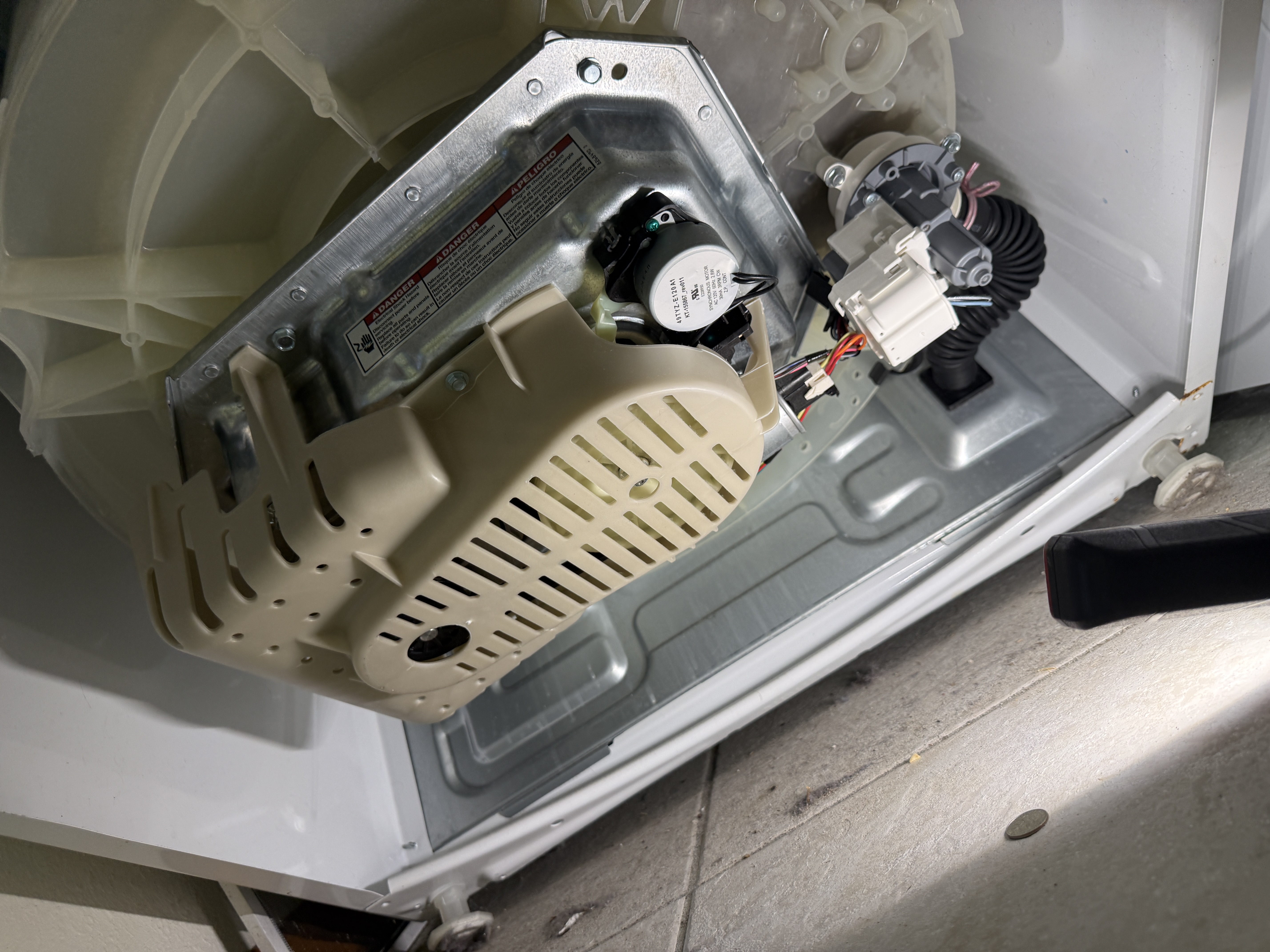Rear panel removed from the Kenmore washer, showing the motor and drain pump assembly