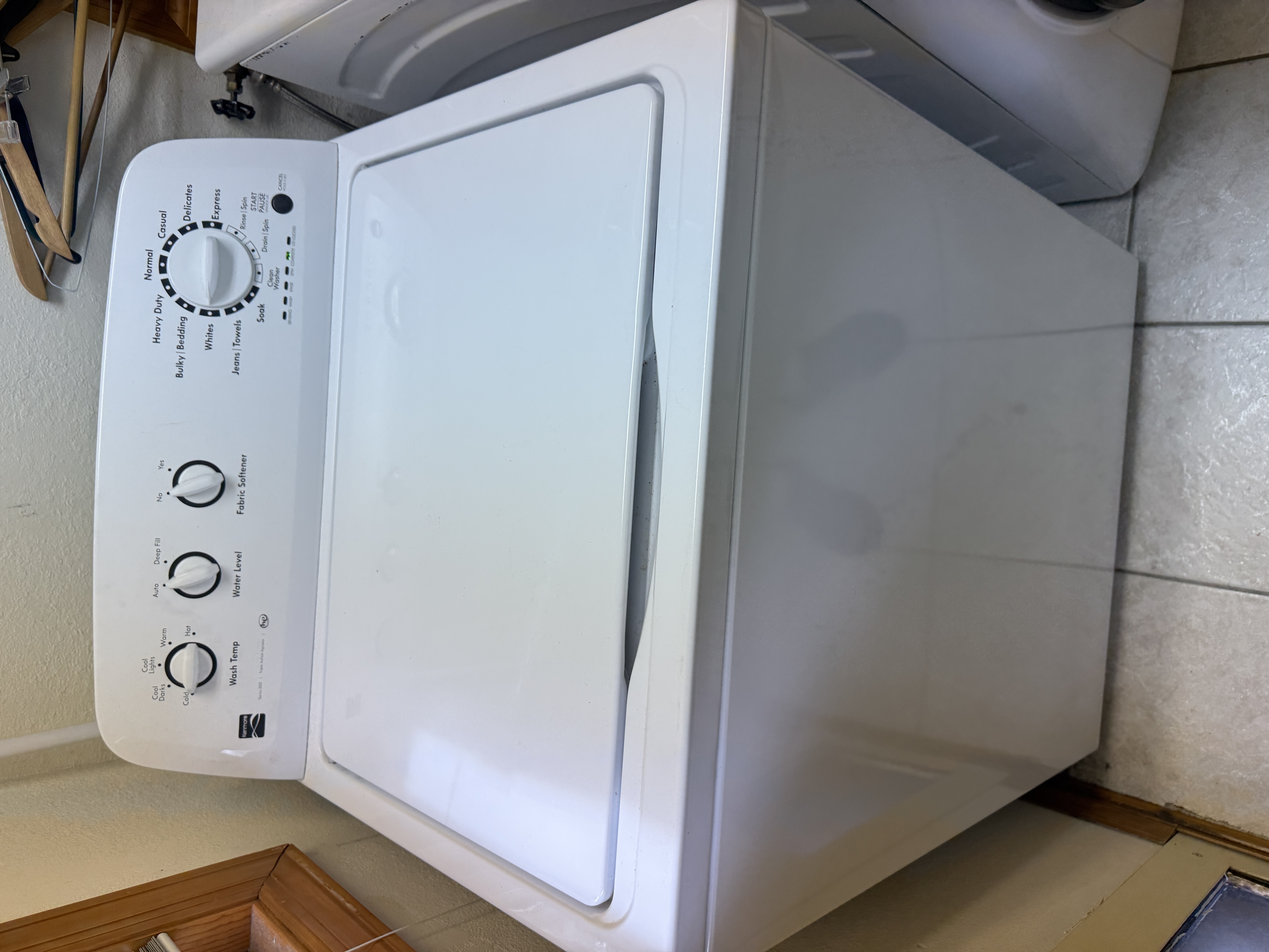 Kenmore top-load washer in a Clearwater rental property laundry room