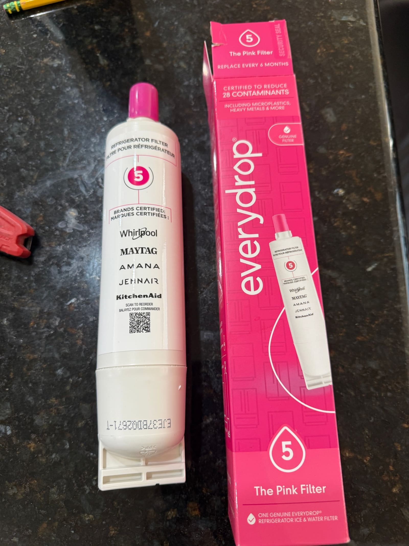 New everydrop filter 5 refrigerator water filter next to its pink box