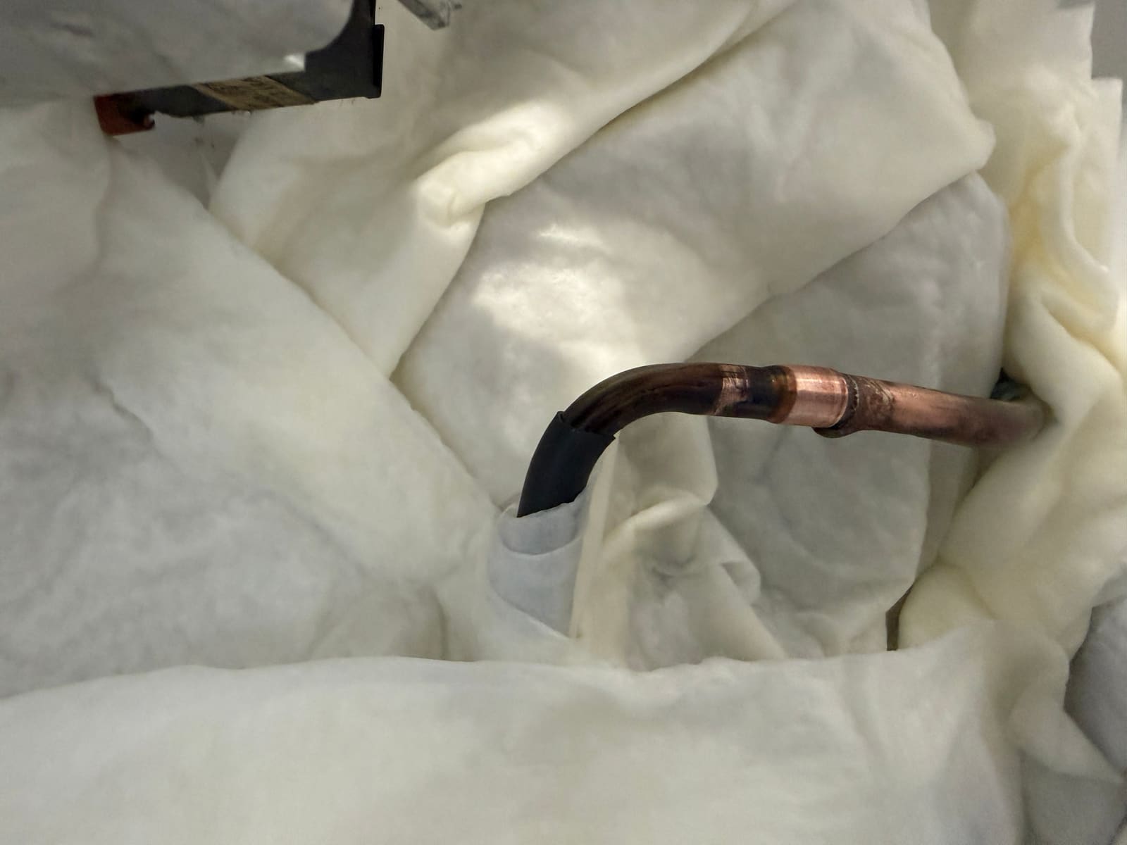 Freshly brazed evaporator line joint before being wrapped in insulation