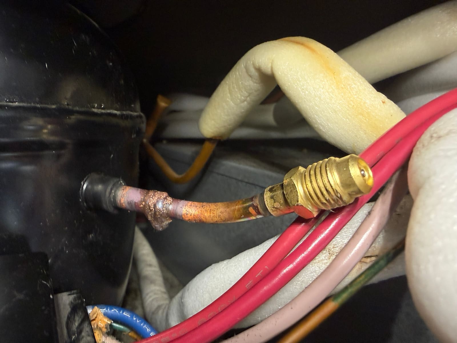Temporary service valve installed on the refrigerator's sealed system for nitrogen pressure testing