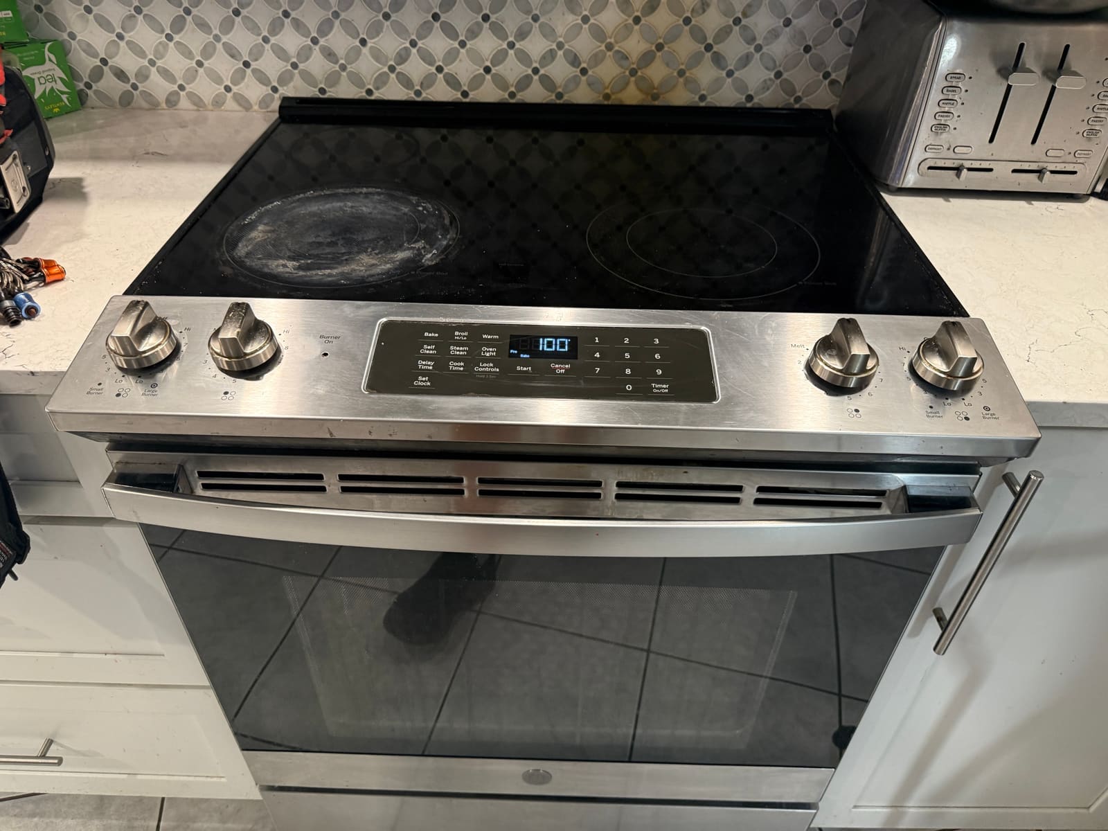 LG slide-in range with glass cooktop and digital control panel in the Ozona neighborhood of Palm Harbor