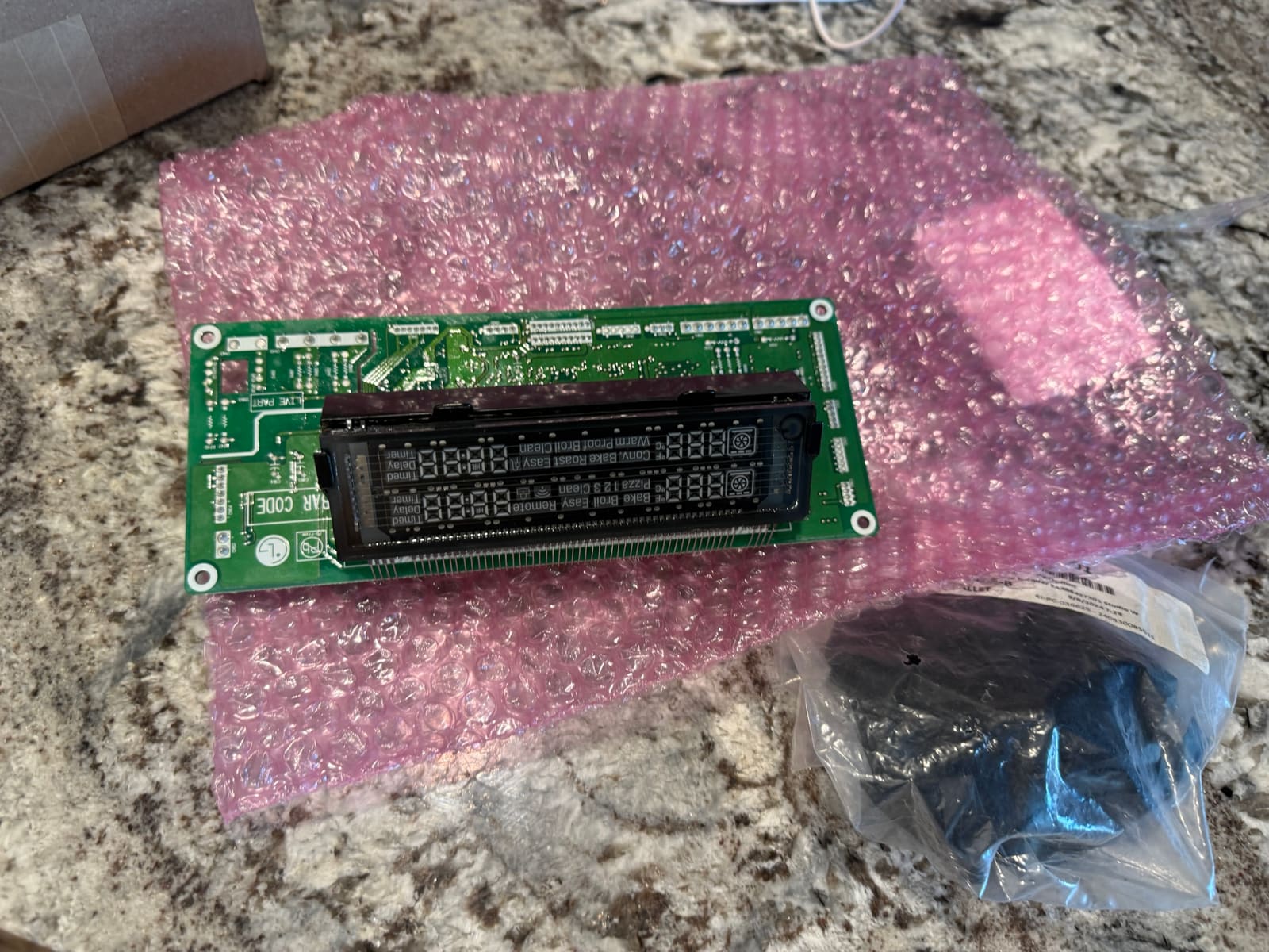New LG display board for the double oven range unpacked on its anti-static bubble wrap