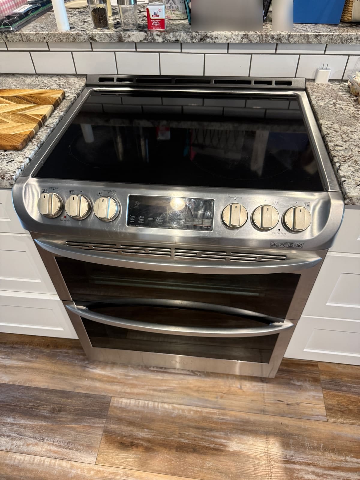LG stainless electric double oven range with a glass cooktop in a kitchen in Safety Harbor