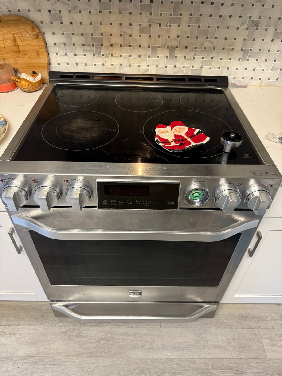 LG range with the Oven Control knob removed, showing the exposed switch on the panel