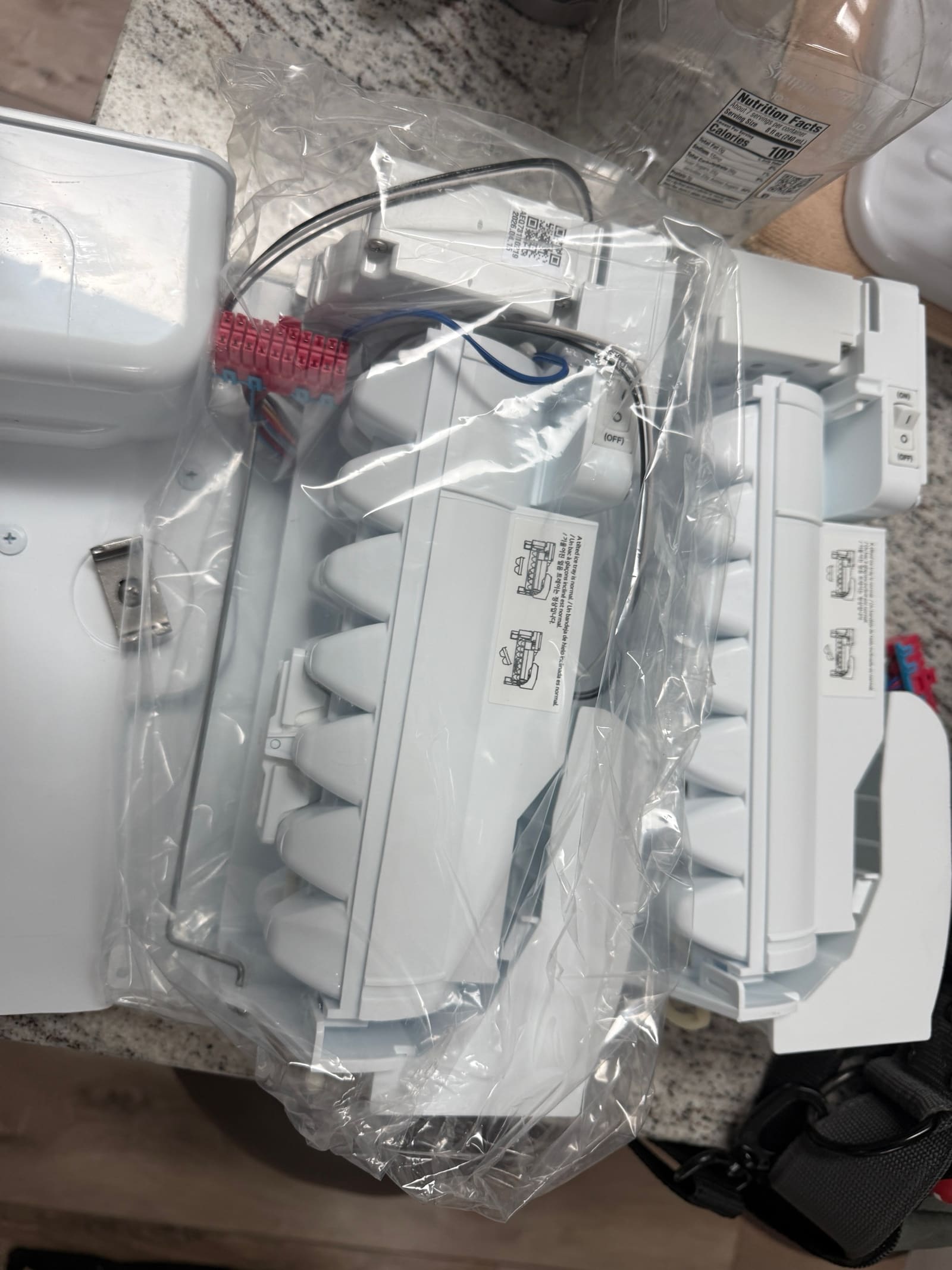 New LG ice maker assembly still in its factory packaging
