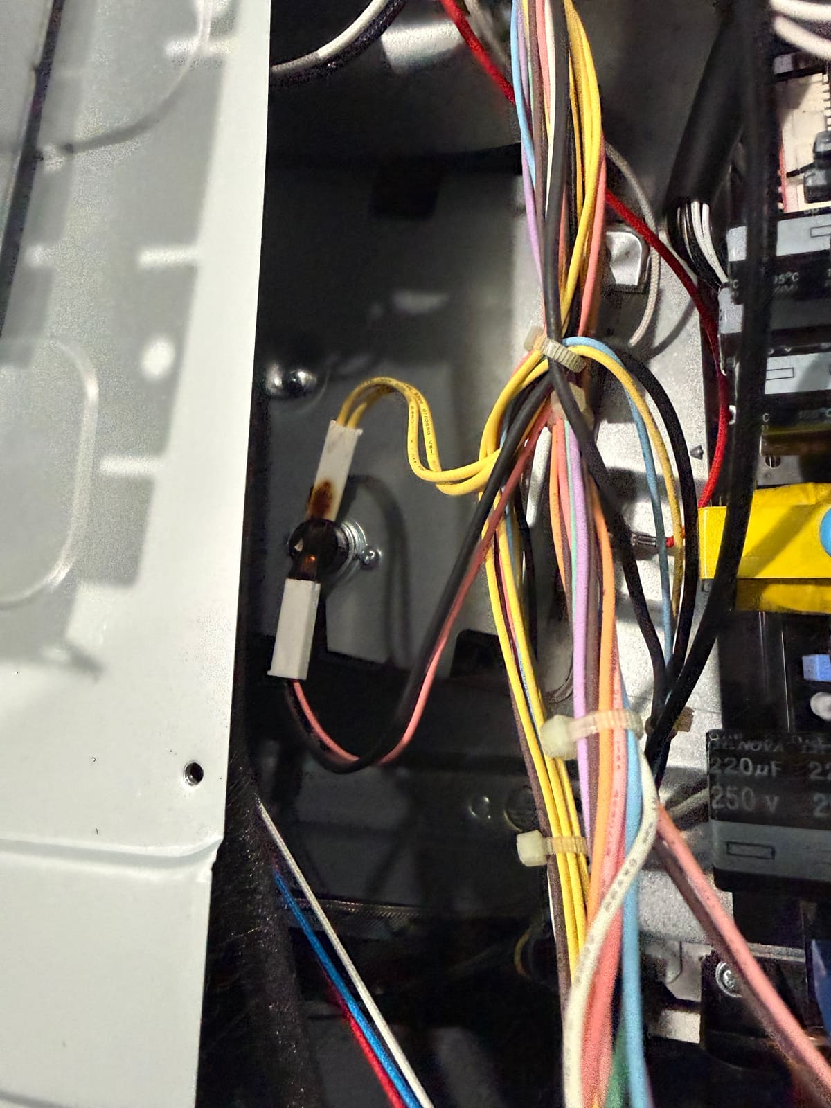 Burned wire terminal on a thermal fuse inside the LG combo wall oven