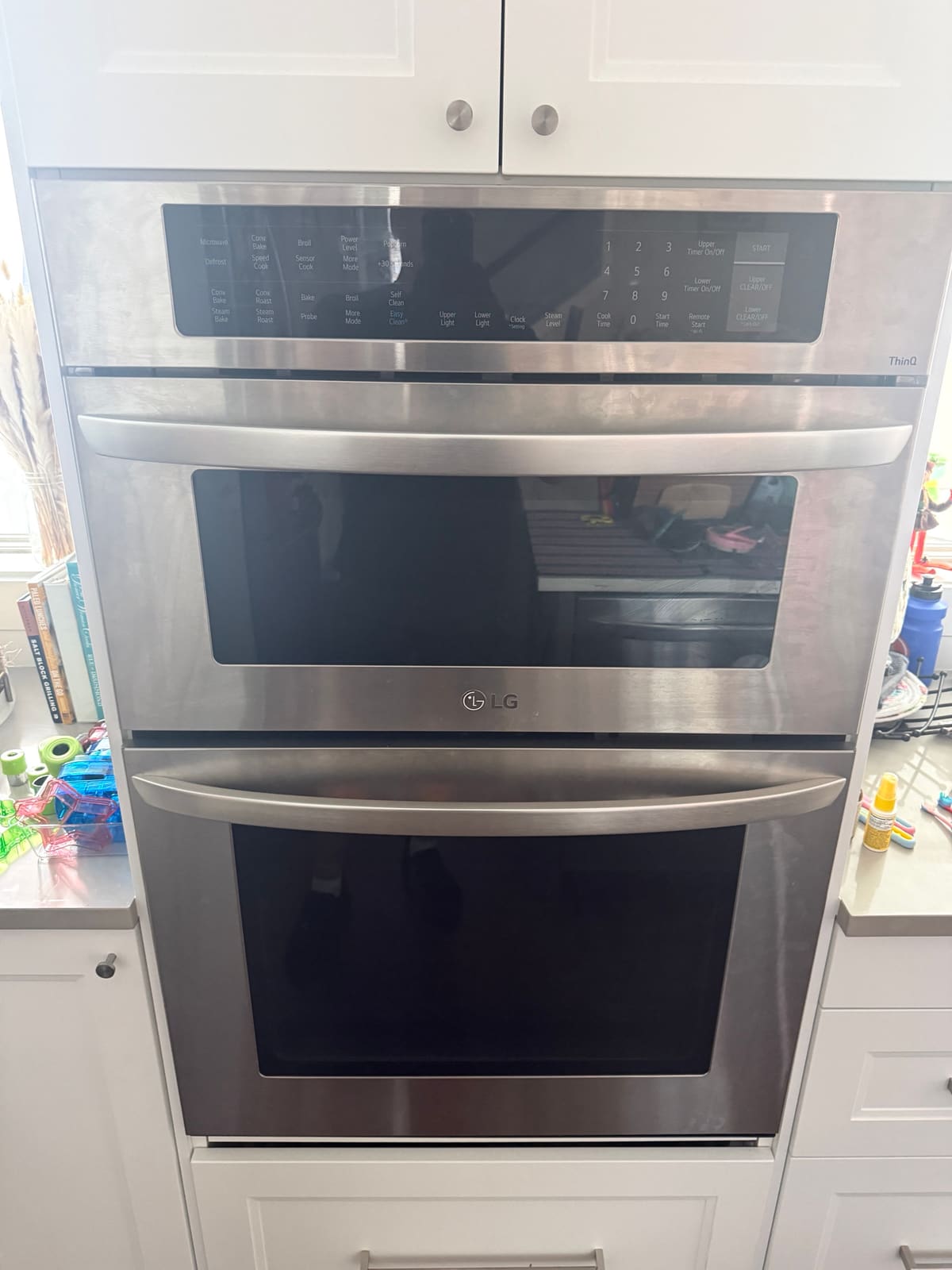 LG stainless microwave and wall oven combination with a blank display in a kitchen in Oldsmar