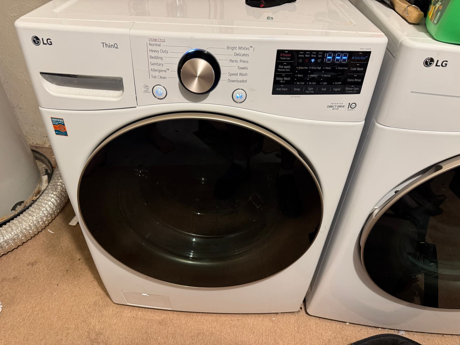 LG ThinQ front-load washer with digital control panel in a laundry room in Oldsmar