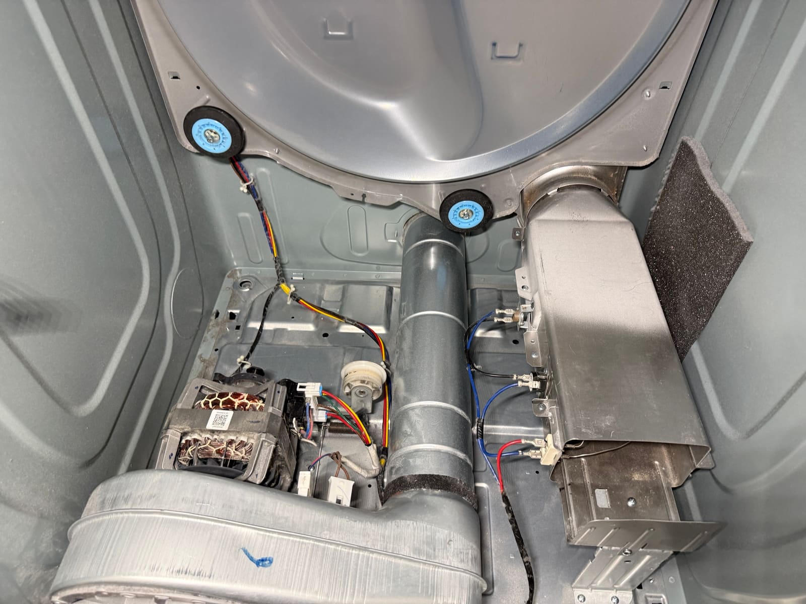 Inside of the Samsung dryer after cleaning, with the new heater can installed and lint removed