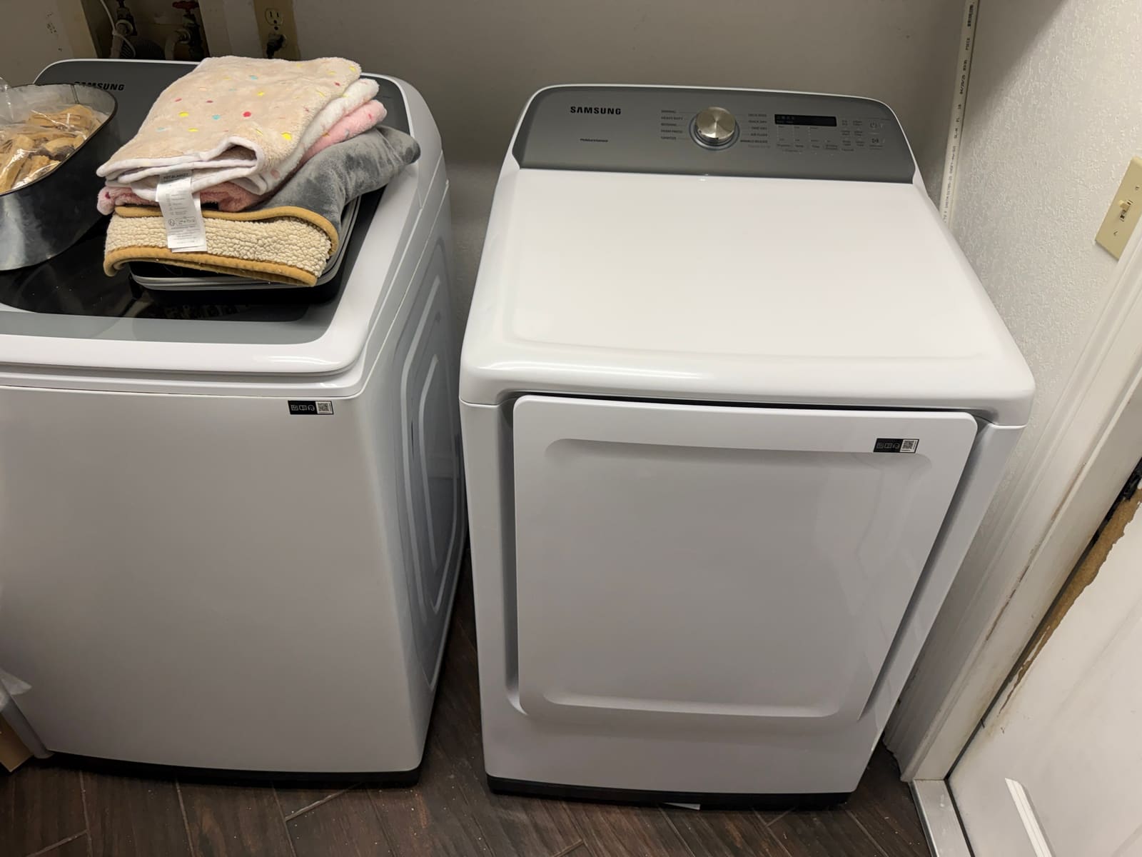 Samsung top-load washer and electric dryer side by side in a laundry room in Clearwater