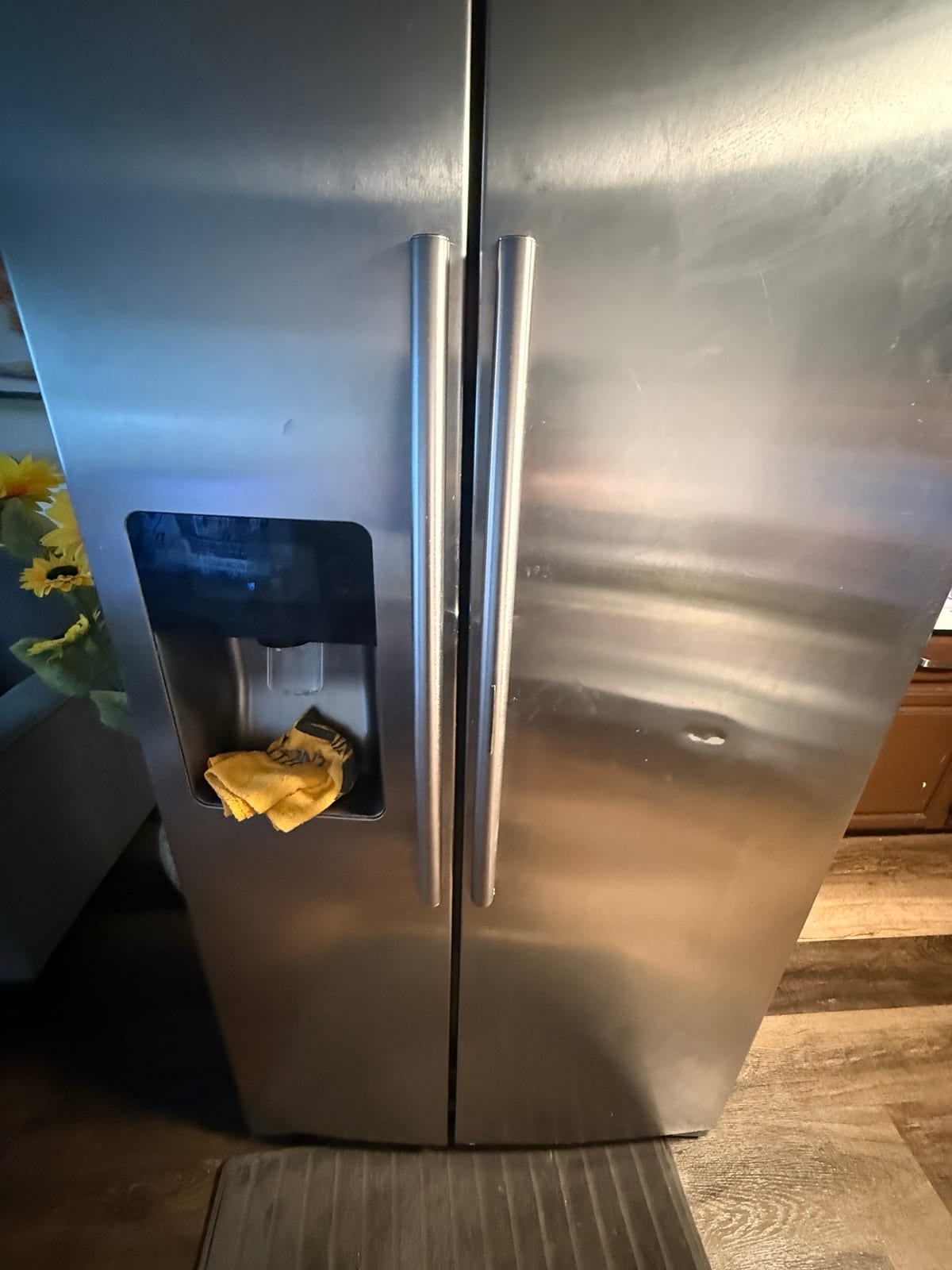 Stainless Samsung side-by-side refrigerator with an ice and water dispenser in a Westchase, Tampa kitchen