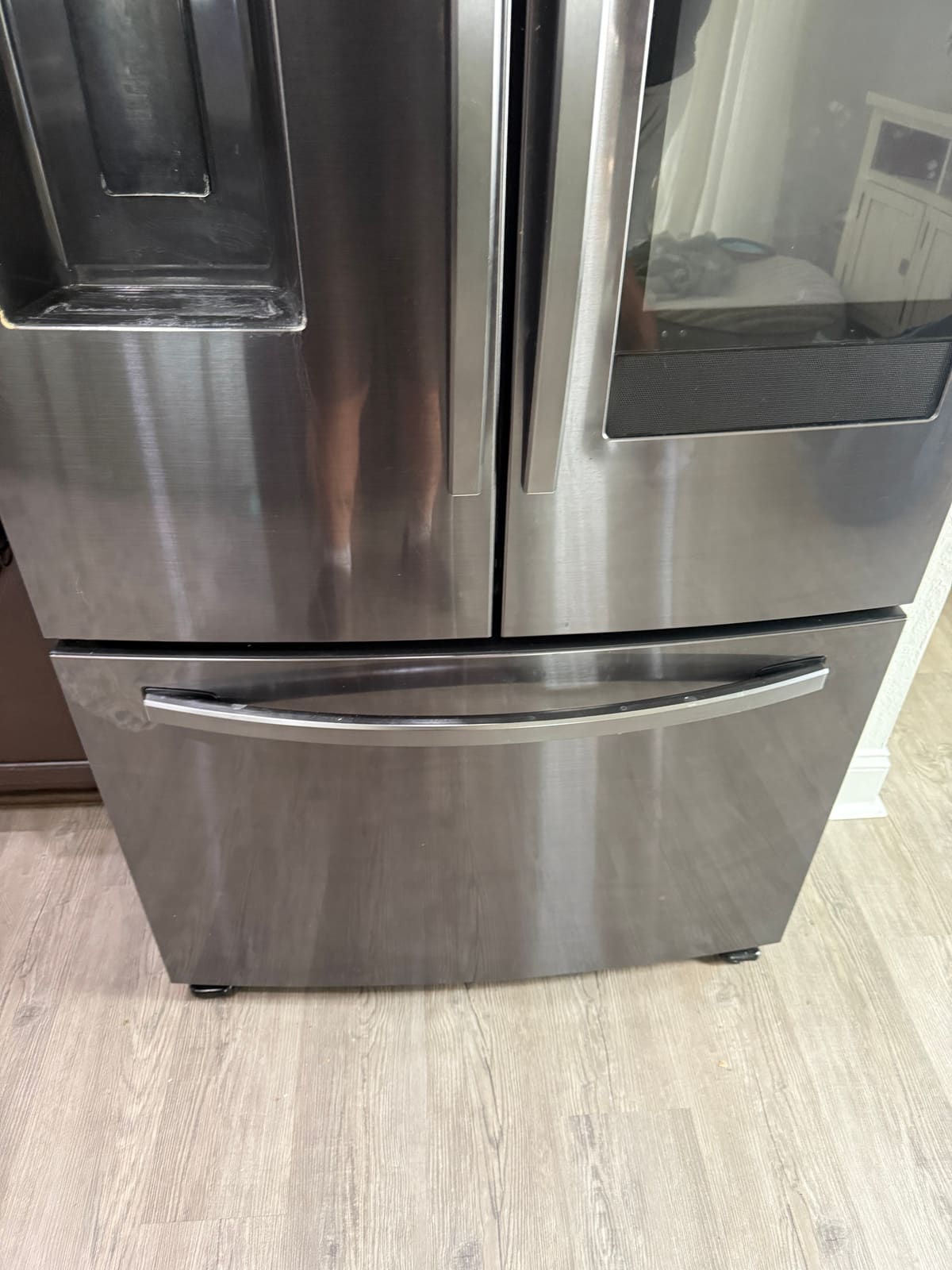 Samsung Family Hub black stainless French door refrigerator in a kitchen in the Westchester neighborhood of Westchase
