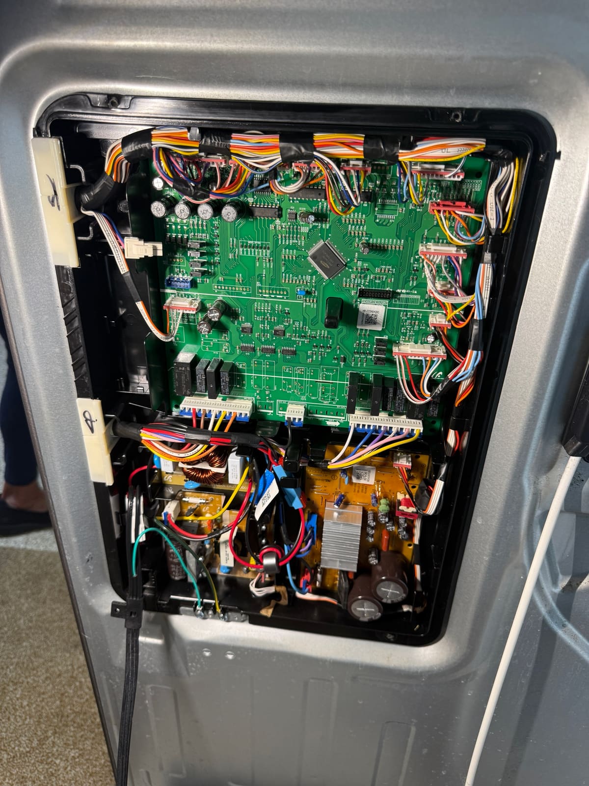Samsung refrigerator main control board and power boards behind the rear cover