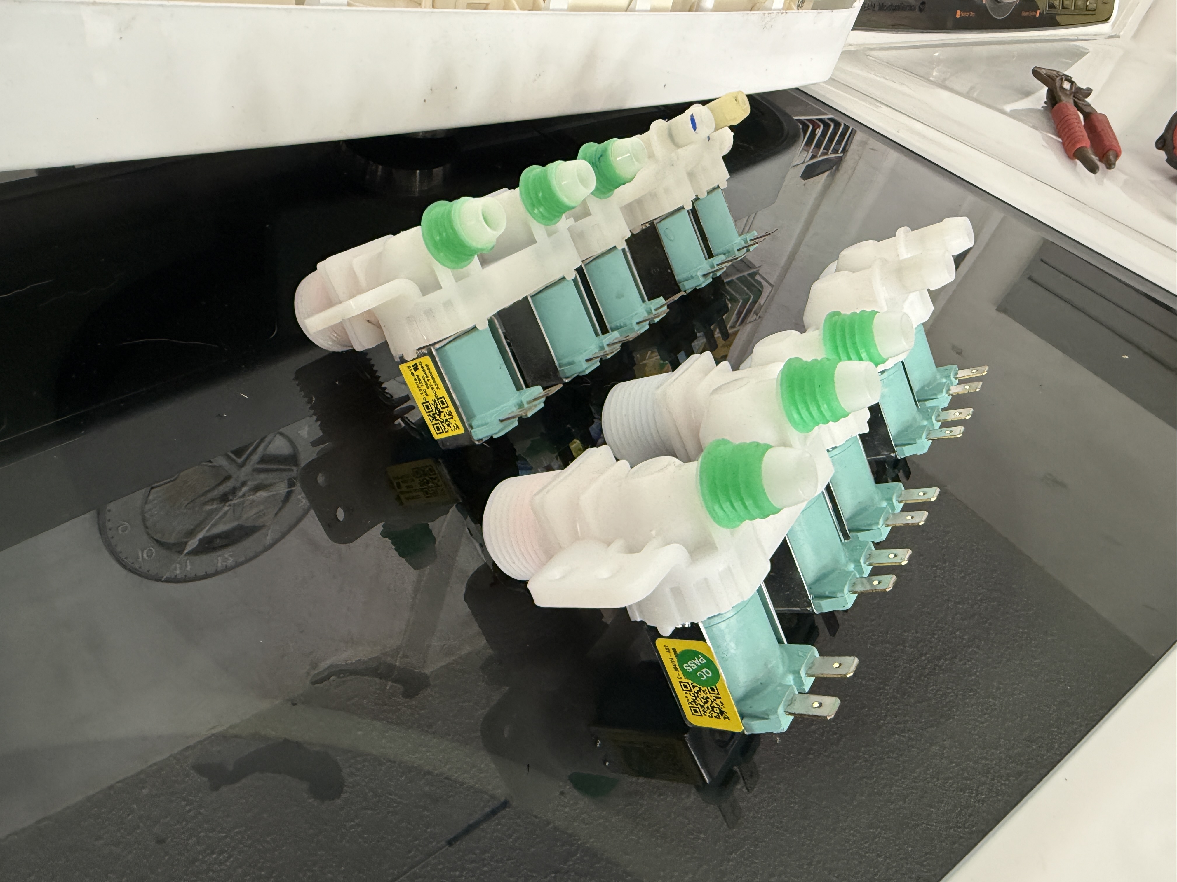 Old and new water inlet valve assemblies for the Samsung washer