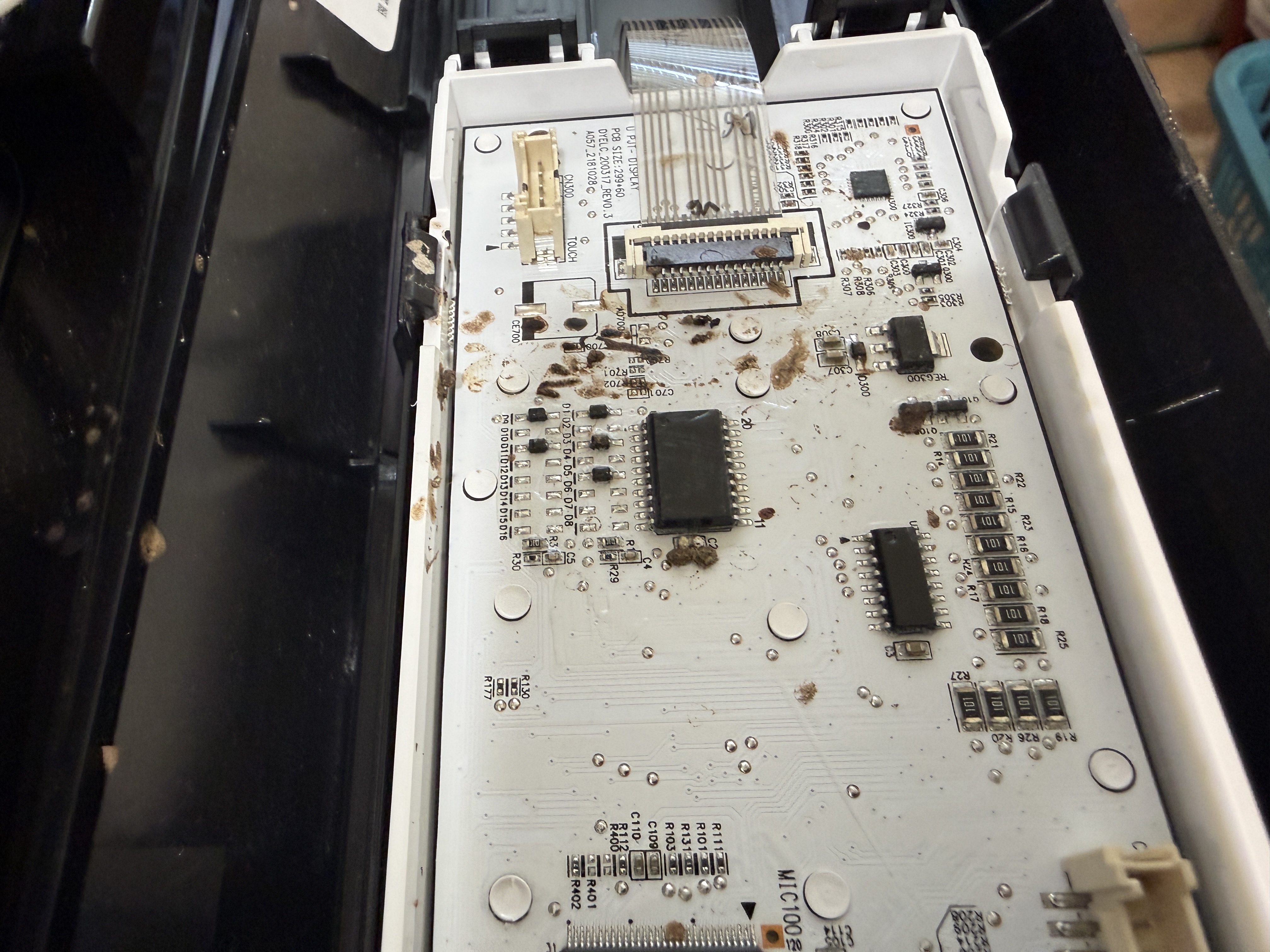 Close-up of the display board showing corrosion and residue from insect damage