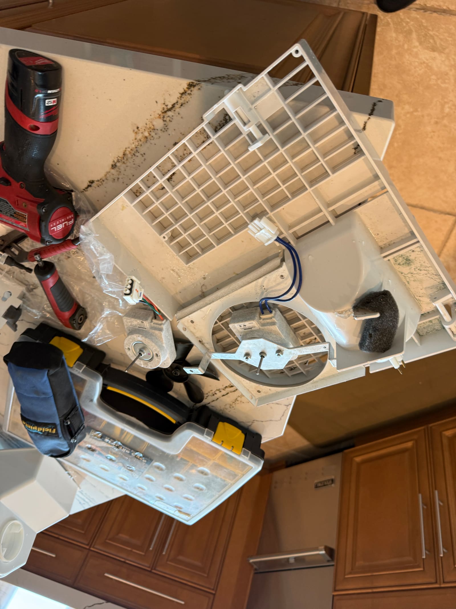New evaporator fan motor mounted back into its panel during reassembly
