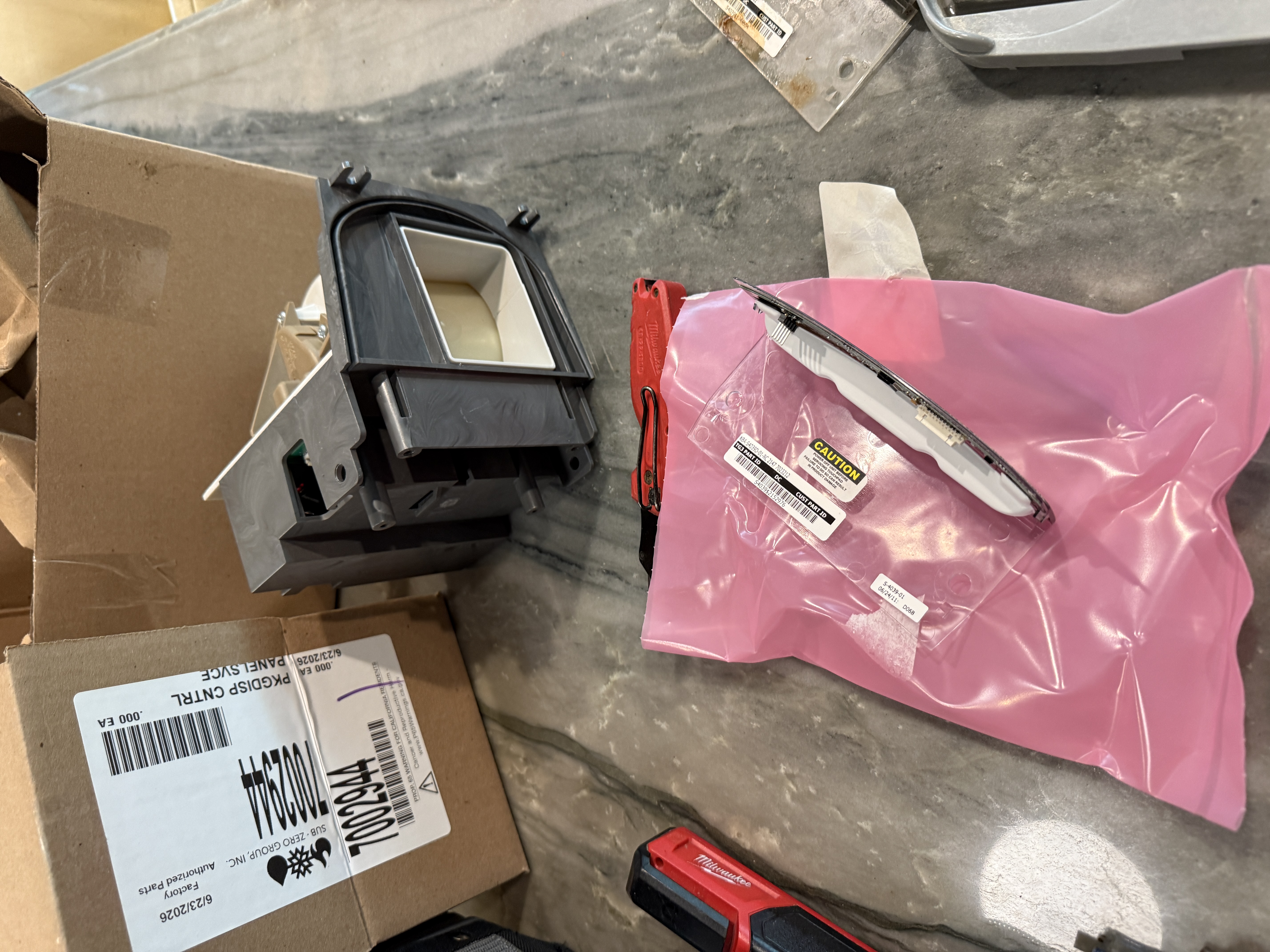 Old dispenser control board next to the new replacement board