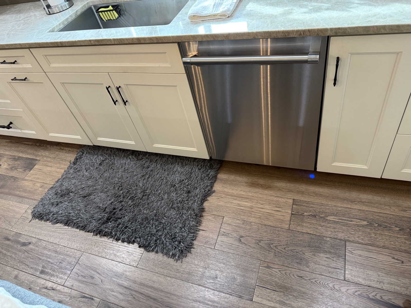 Stainless Thermador dishwasher built in under the counter in a kitchen in Belleair