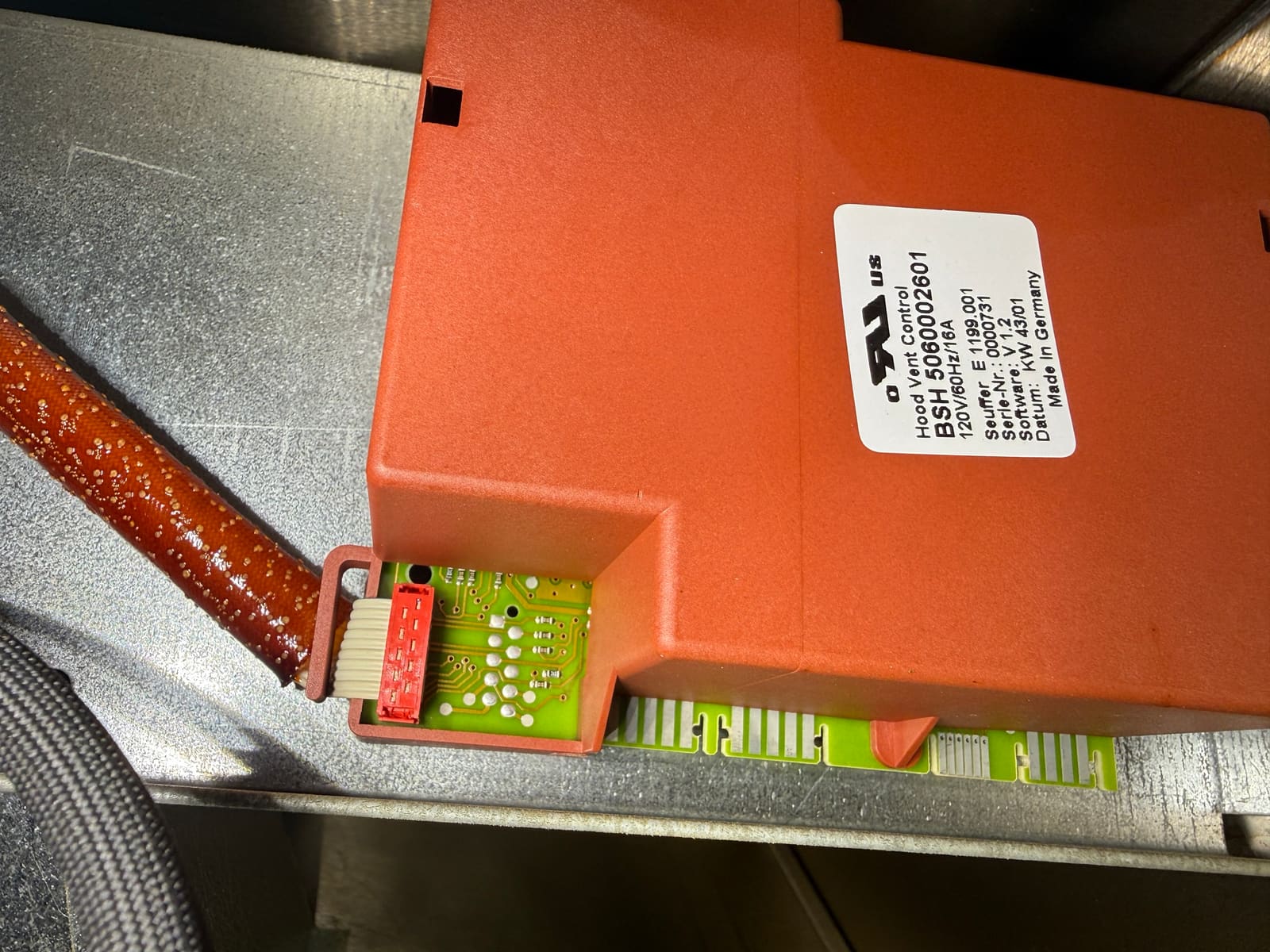 Thermador hood control box made by BSH, labeled Hood Vent Control, with the ribbon cable plugged into the board