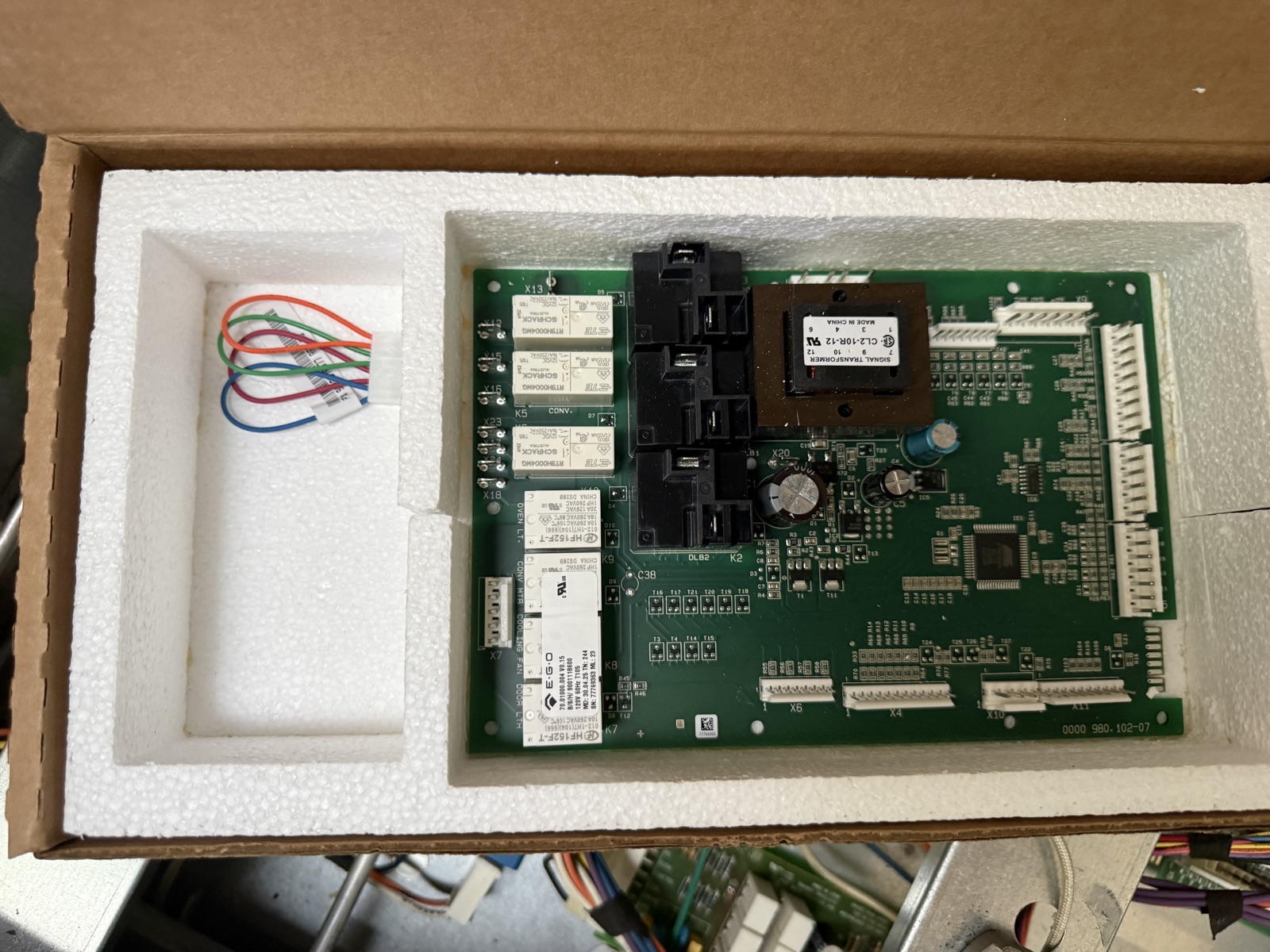 New Thermador range control board in its foam packaging