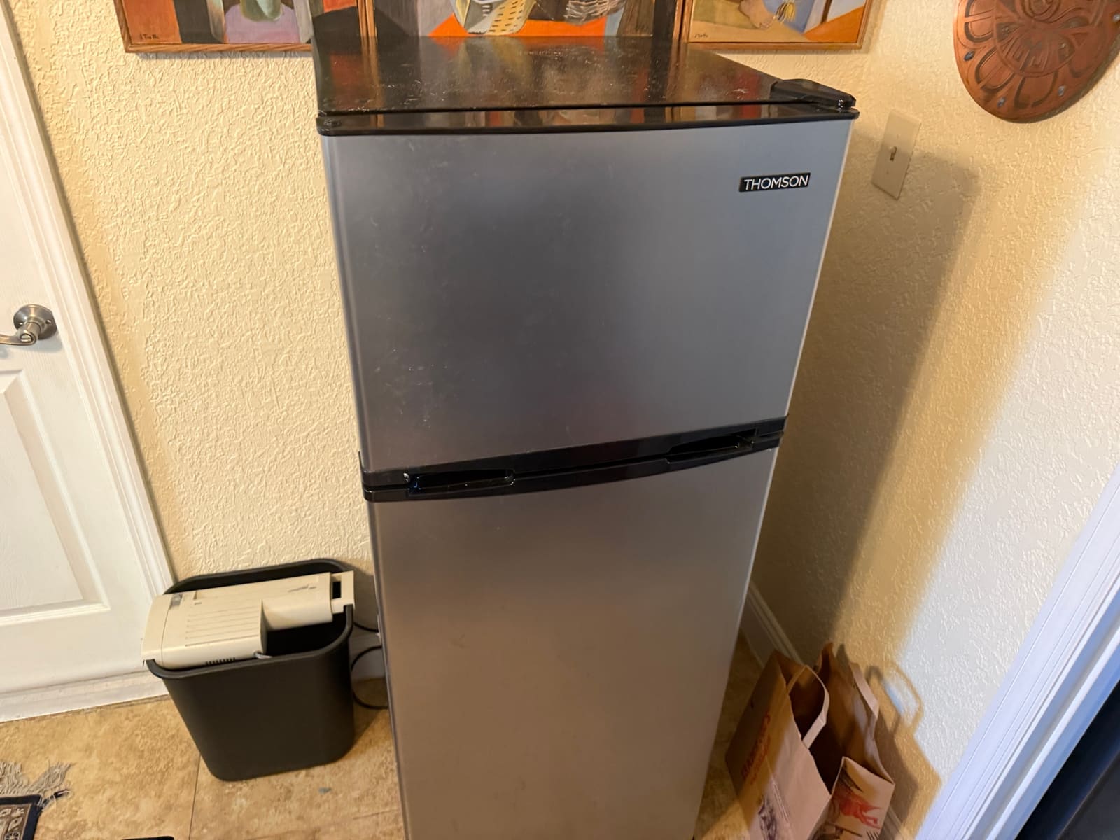 Small Thomson mini fridge in a home in Palm Harbor