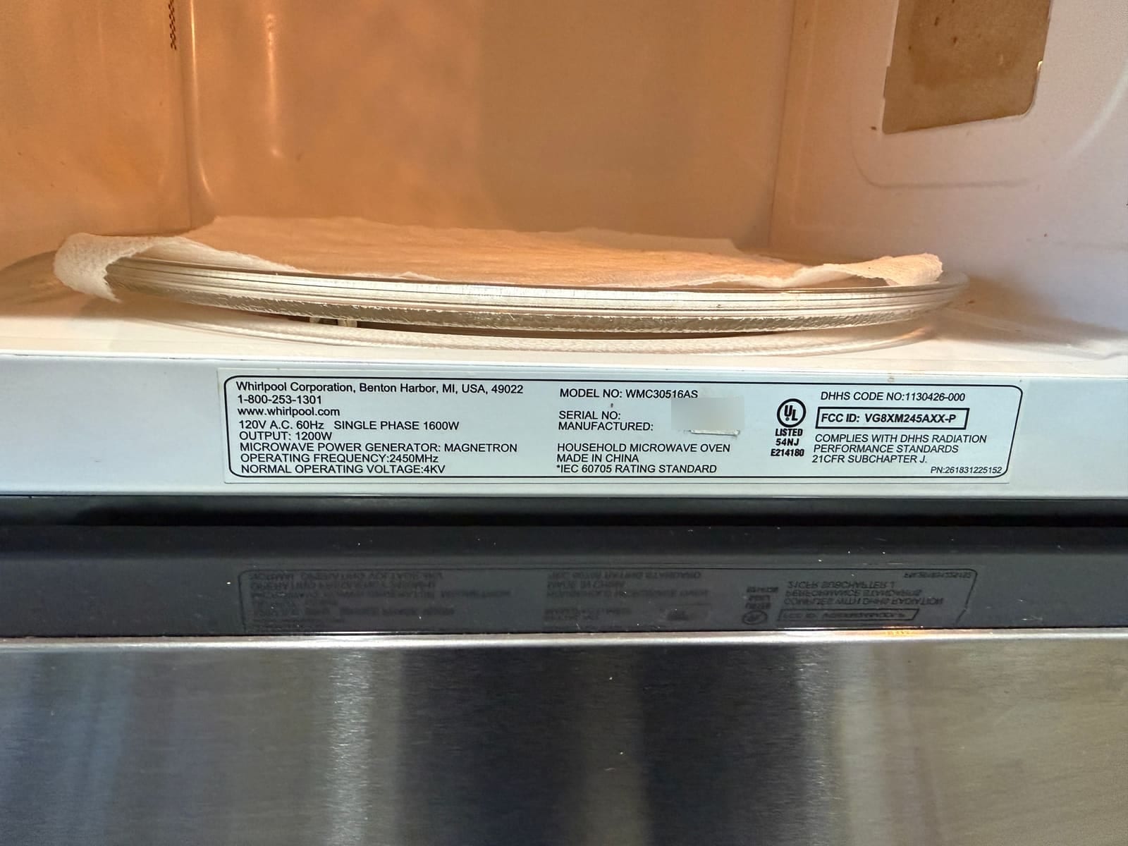 Whirlpool microwave data plate, model WMC30516AS, with the serial number blurred
