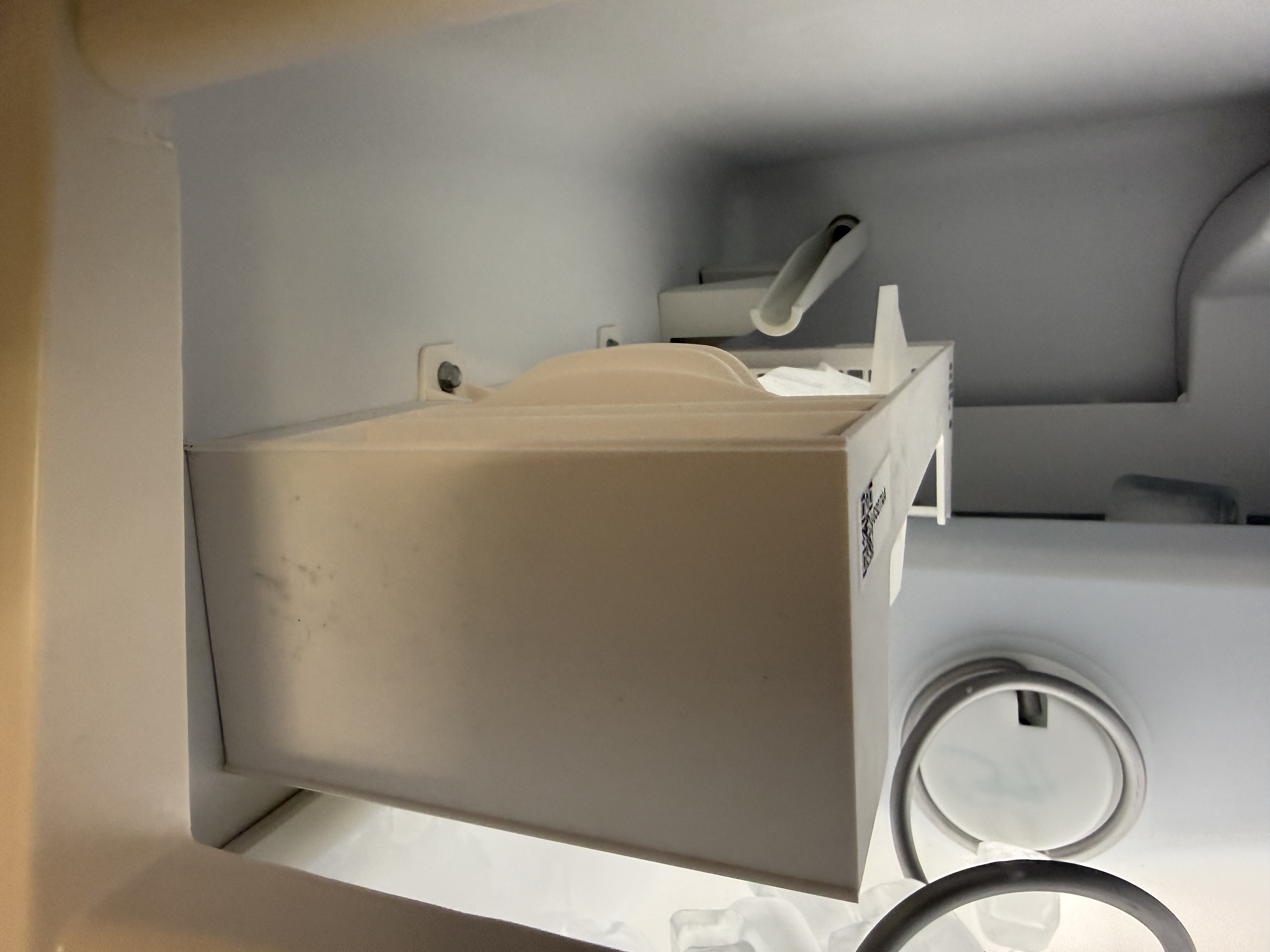 New icemaker module installed in the Whirlpool refrigerator's freezer