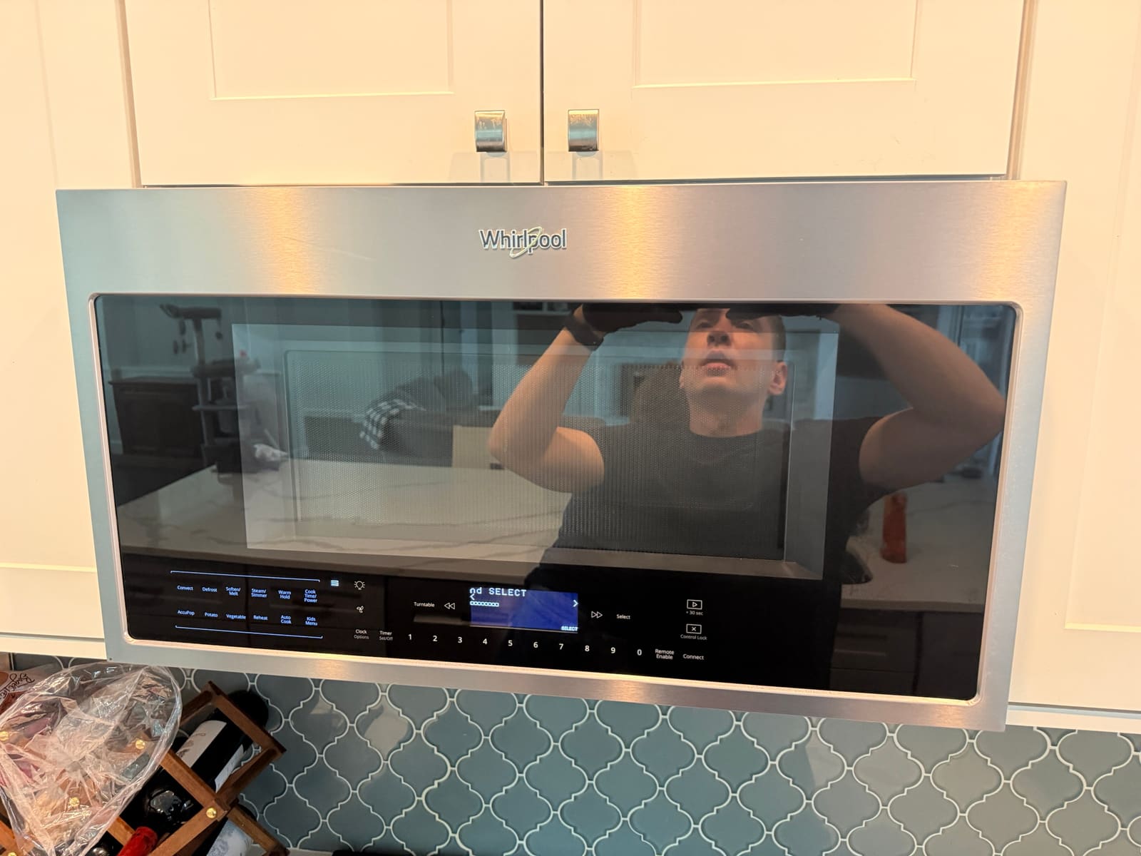 Whirlpool over-the-range microwave installed above a stove in Safety Harbor