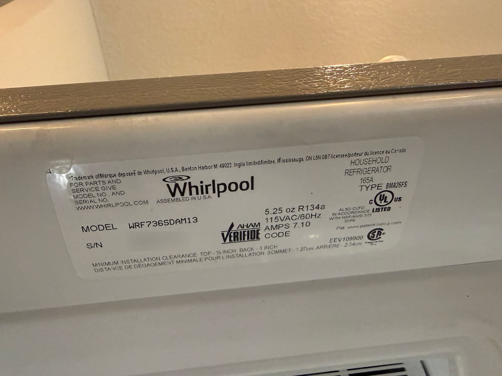 Whirlpool refrigerator data plate showing model WRF736SDAM13