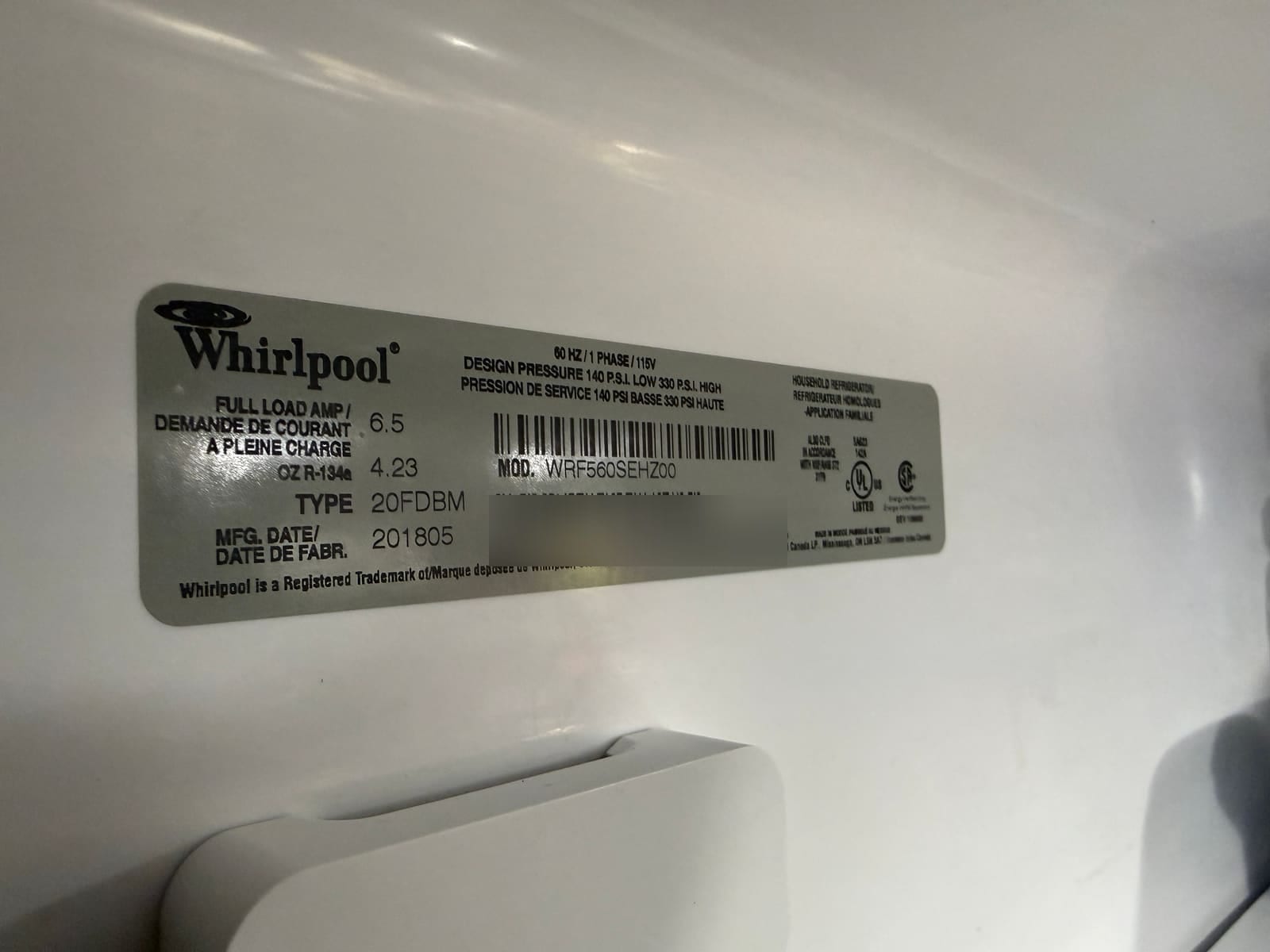 Whirlpool data plate showing model WRF560SEHZ00, manufactured May 2018, R134a refrigerant