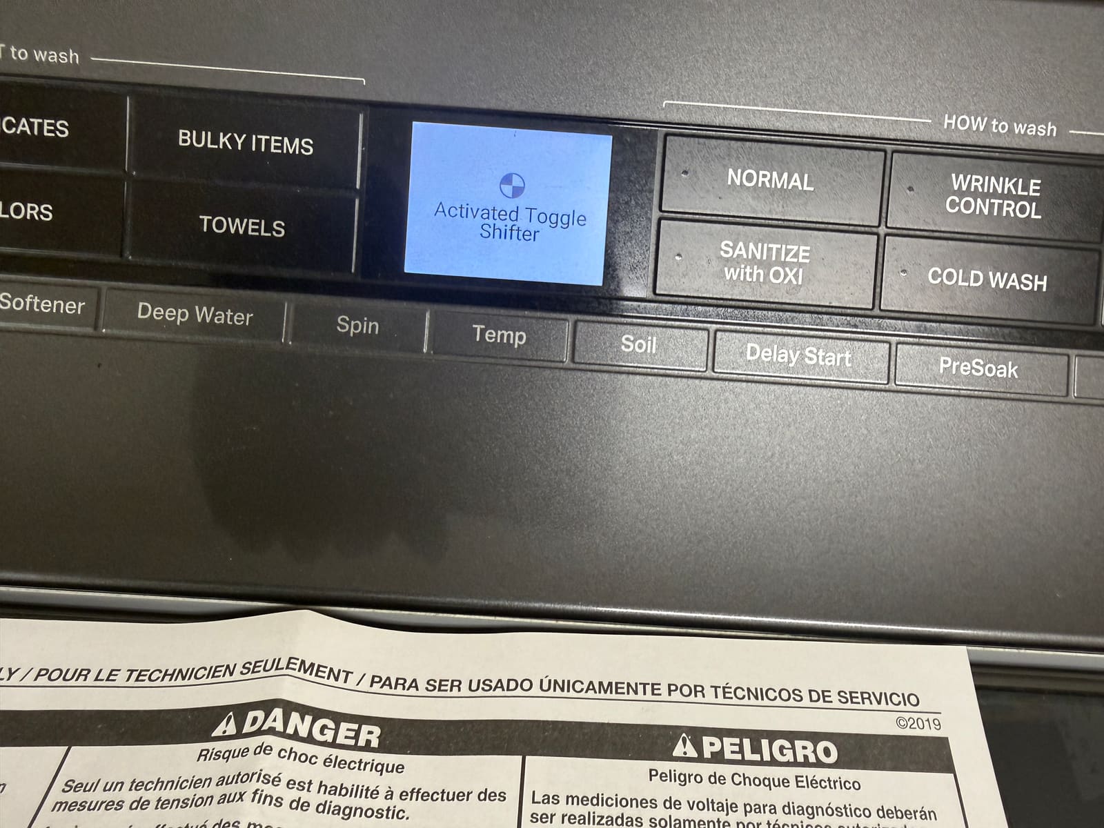 Whirlpool washer diagnostic mode showing an Activated Toggle Shifter readout on the control panel