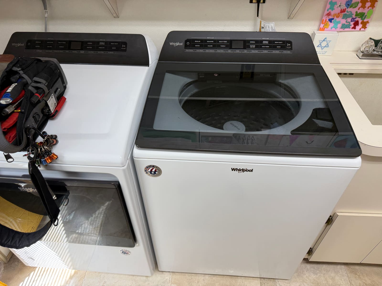 Whirlpool top-load washer and dryer set in a laundry room in the Eniswood neighborhood of Palm Harbor
